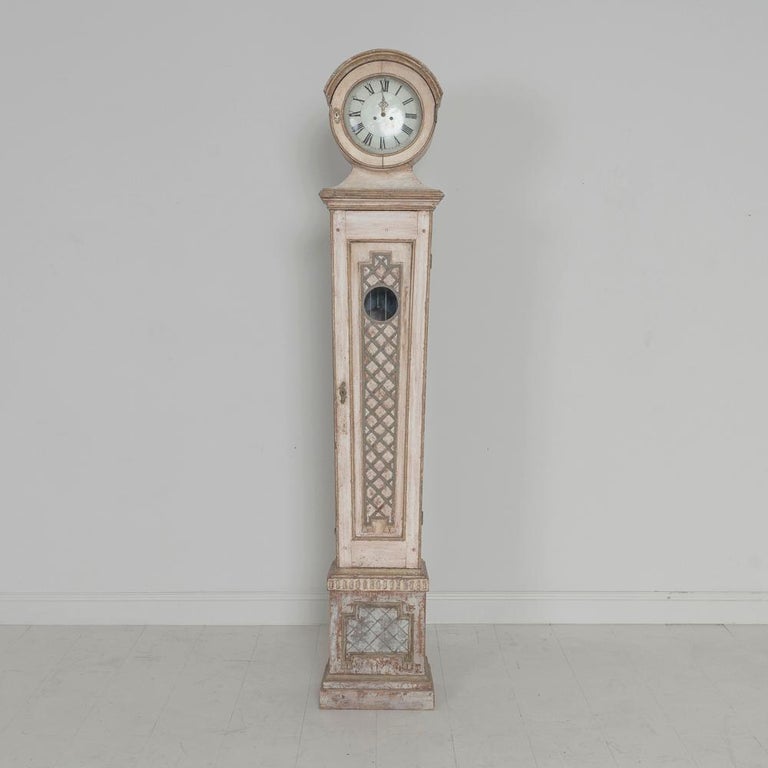 This is a rare Swedish Mora clock with exceptional crosshatch detail in the neoclassical style, circa 1810. Original face, clockworks, pendulum and weights. This clock has been cleaned and serviced and is operating with its original works.