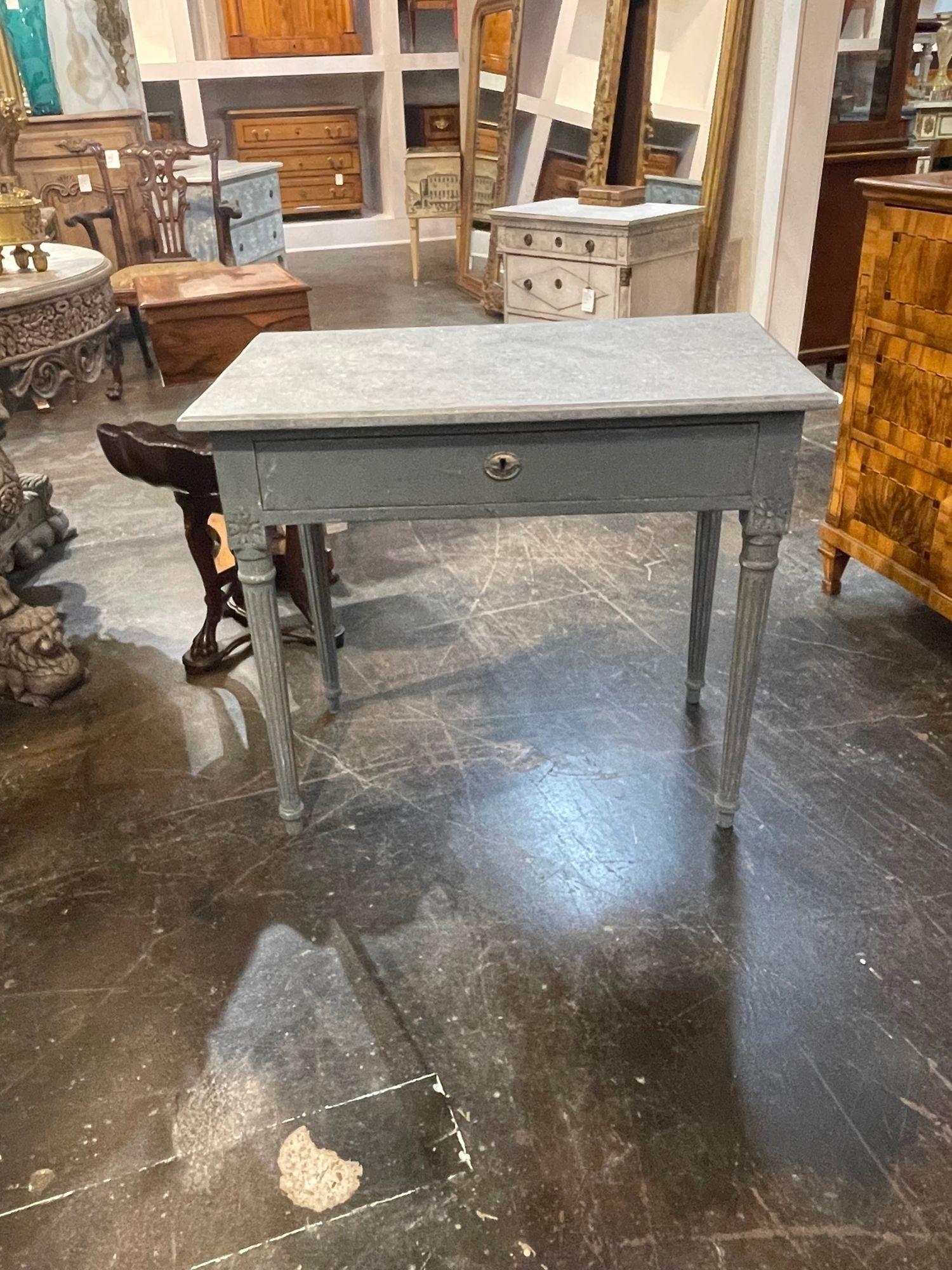 Lovely 19th century Swedish Neo-Classical carved and painted side table. This piece has a pretty grey and white patina and nice clean lines. Great for a variety of decors!