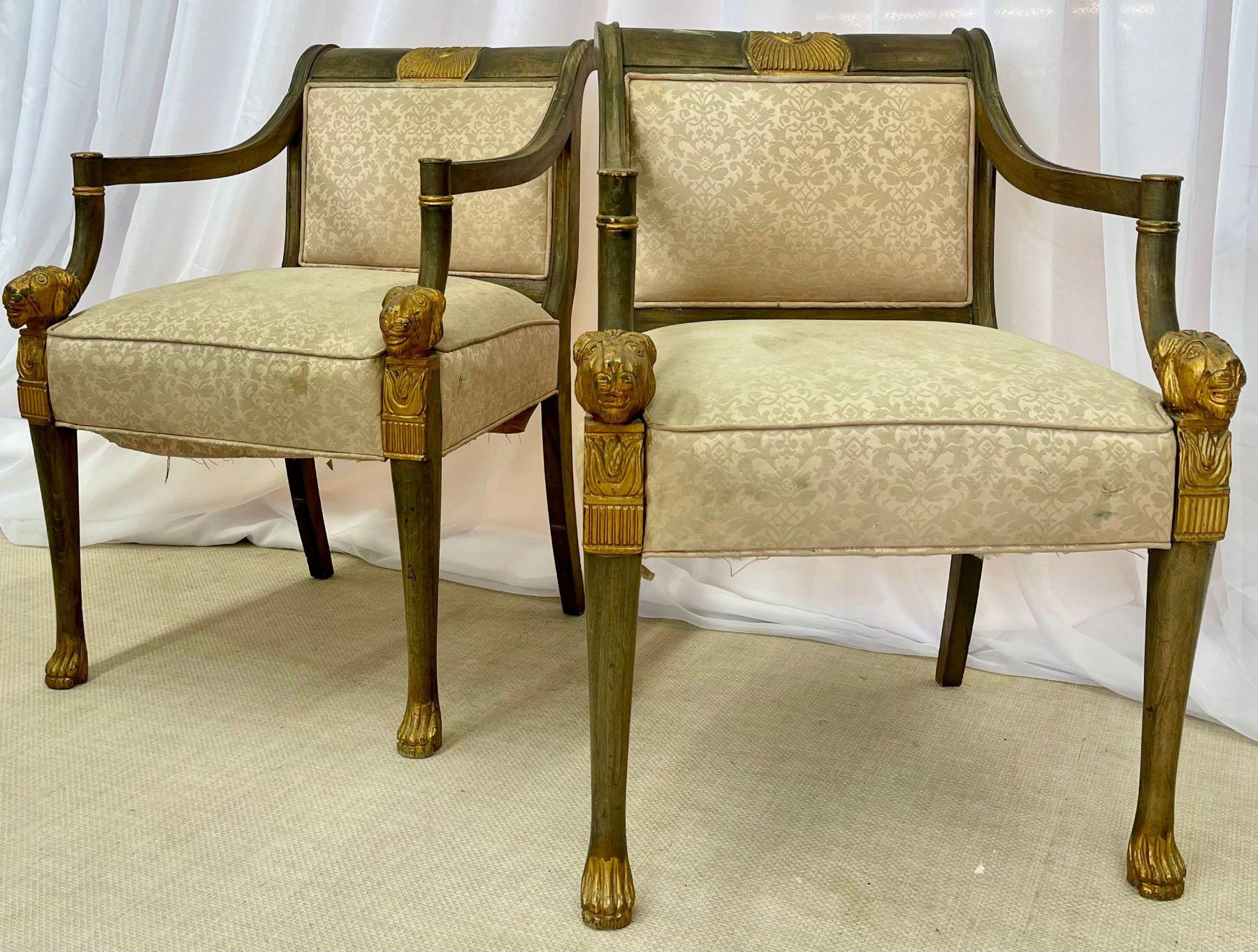 19th century Swedish neoclassical arm chairs. 

A pair of finely carved parcel gilt and paint decorated arm chairs or fauteuils. Each having gilt claw feet with intricately detailed gilt lion heads at the end of the arm rests. The frame is painted
