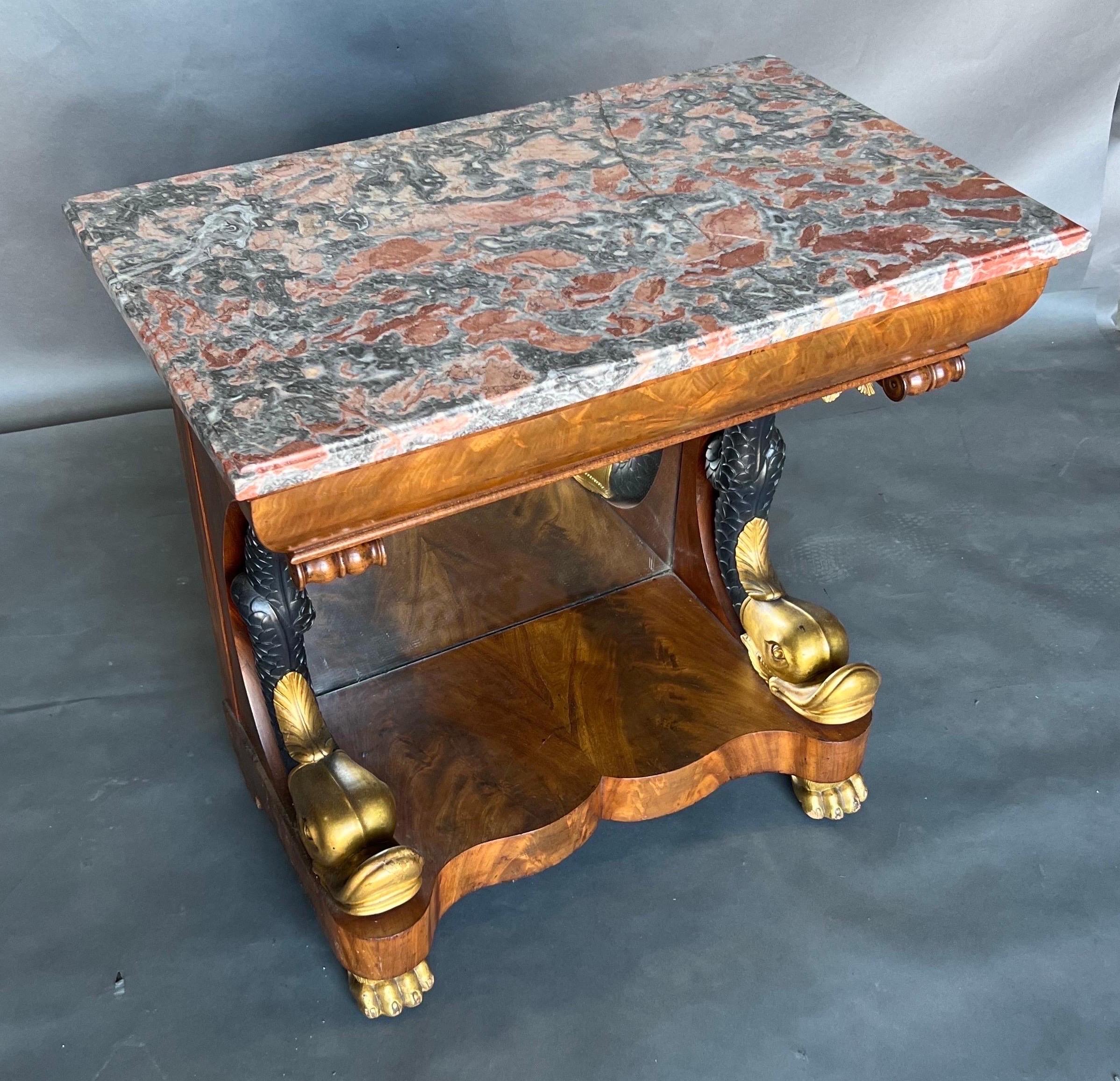 Handsome little Neoclassical Swedish or French Single Drawer Console Table with Gilt dophins, mirrored back, marble top resting on gilt paw feet. On the bottom of the drawer there is a label from where it was sold at 