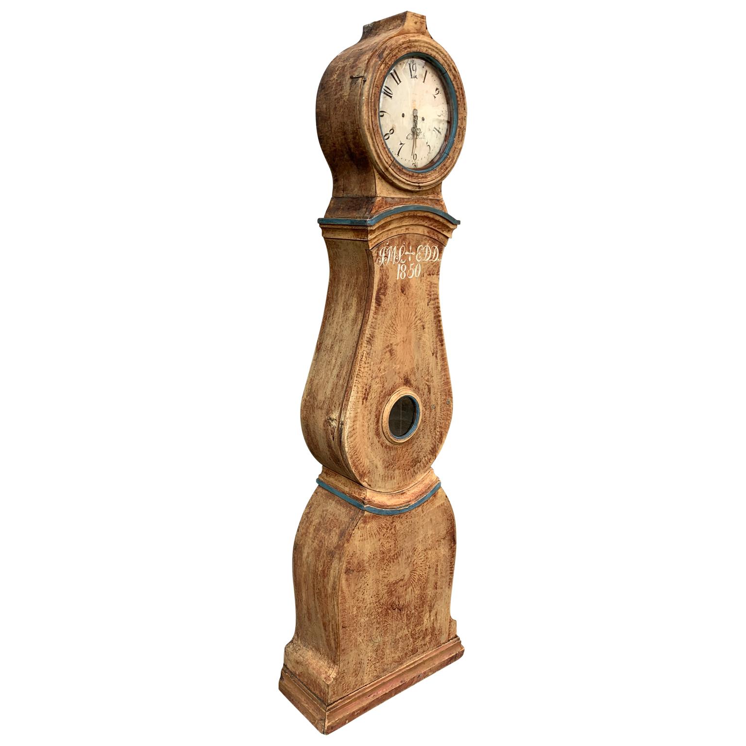 Swedish 19th Century original painted long case clock or Grandfather clock dated 1850. This Scandinavian folk art clock from the town of Mora, famous for clock mechanism production in the region of Dalarna in Sweden, is complete with pendulum and