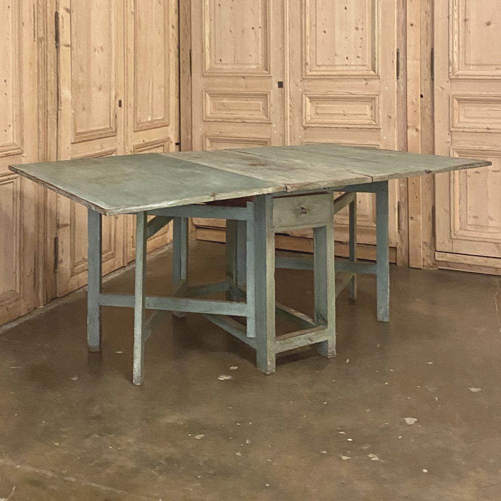 19th century Swedish painted drop-leaf table, sofa table is a marvel of ingenuity! Handcrafted by talented rural artisans, it features two huge leaves that drop down out of the way when not needed, making this a great choice as a sofa or hall table.