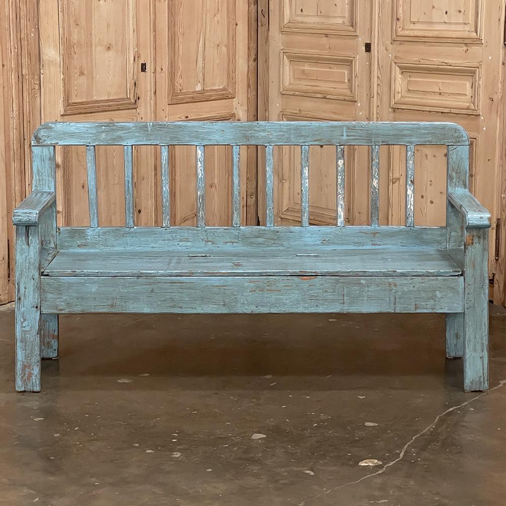 19th century Swedish painted hall bench is a charming piece perfect for hallways, stairwell landings, or cozy room settings. The tailored lines create a rustic simplicity, which combined with the distressed painted finish only add to the allure. The