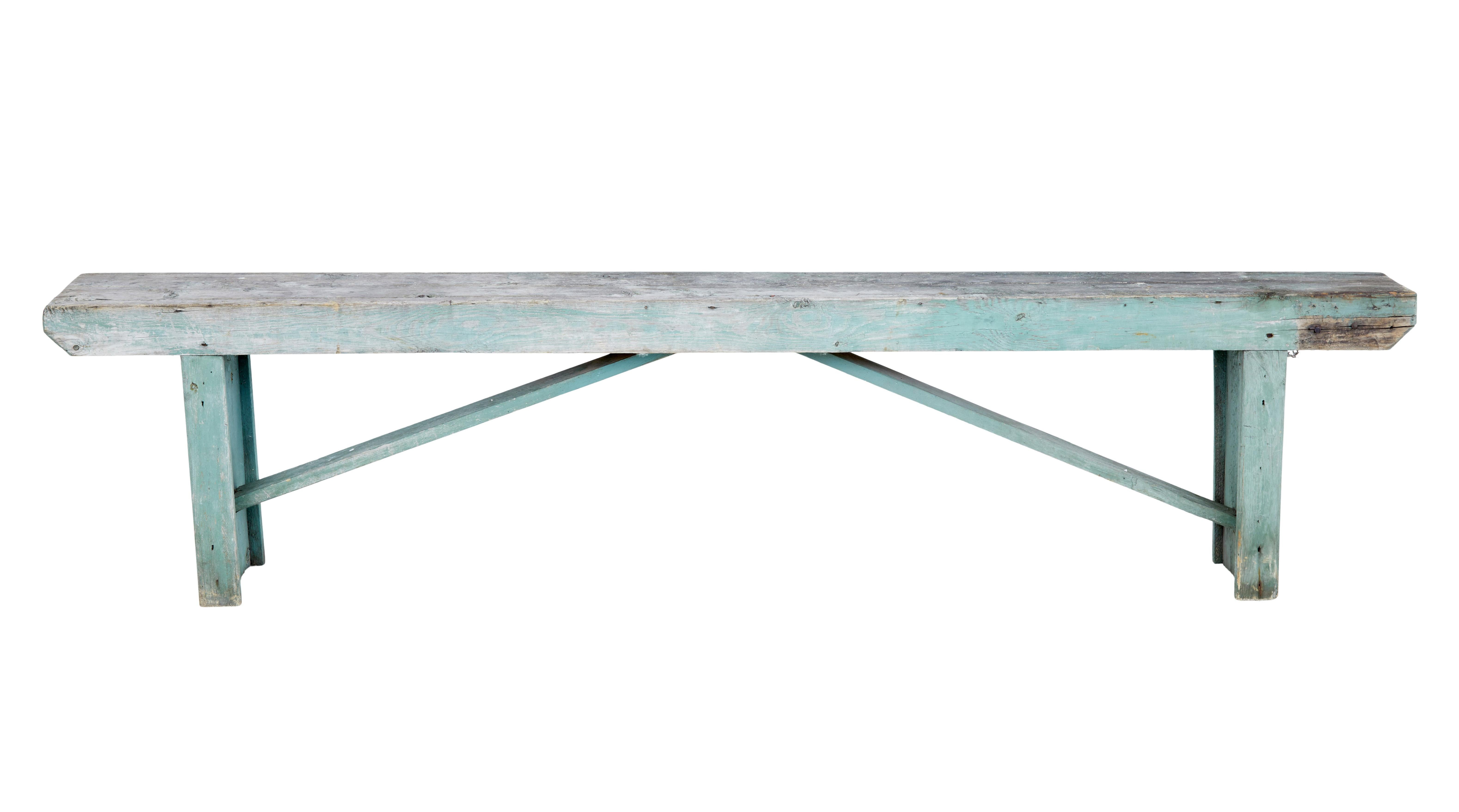 19th century Swedish painted pine bench circa 1890.

19th century Swedish rustic made pine bench made from solid pine. Evidence of original pale blue paint scheme which has since faded. Single plank seating surface, with solid plank ends and