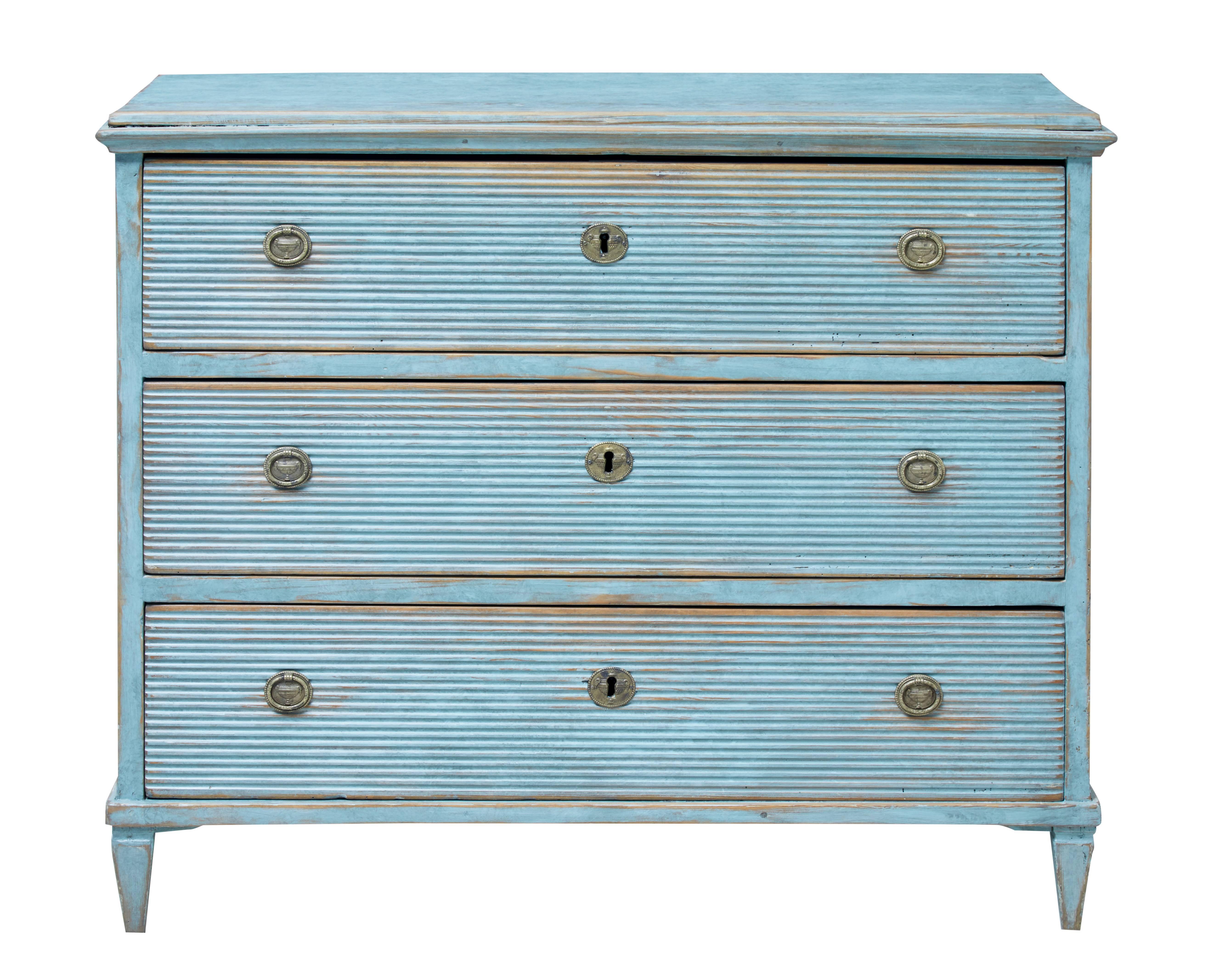 Good quality Swedish painted chest of drawers, circa 1860.

Three drawers all with channeled drawer fronts, loop handles and escutheons.

Standing on tapered legs.

Later paint which has now taken on a distressed finish.