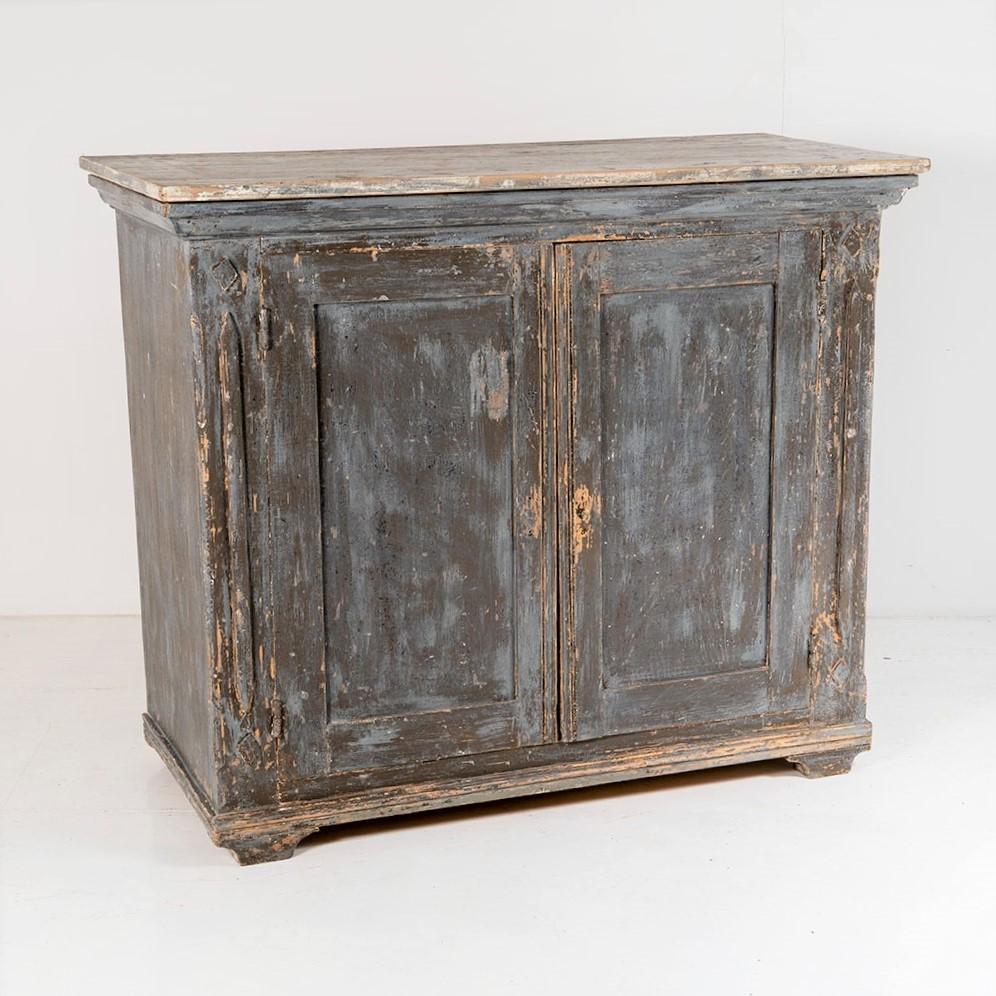 An original, late 19th Century Swedish painted pine cupboard in superb original condition. Lovely detailing, with ogee moulding to the top, diamond motif pillars leading to moulded feet. Two doors, retaining its original lock and key, opening to two
