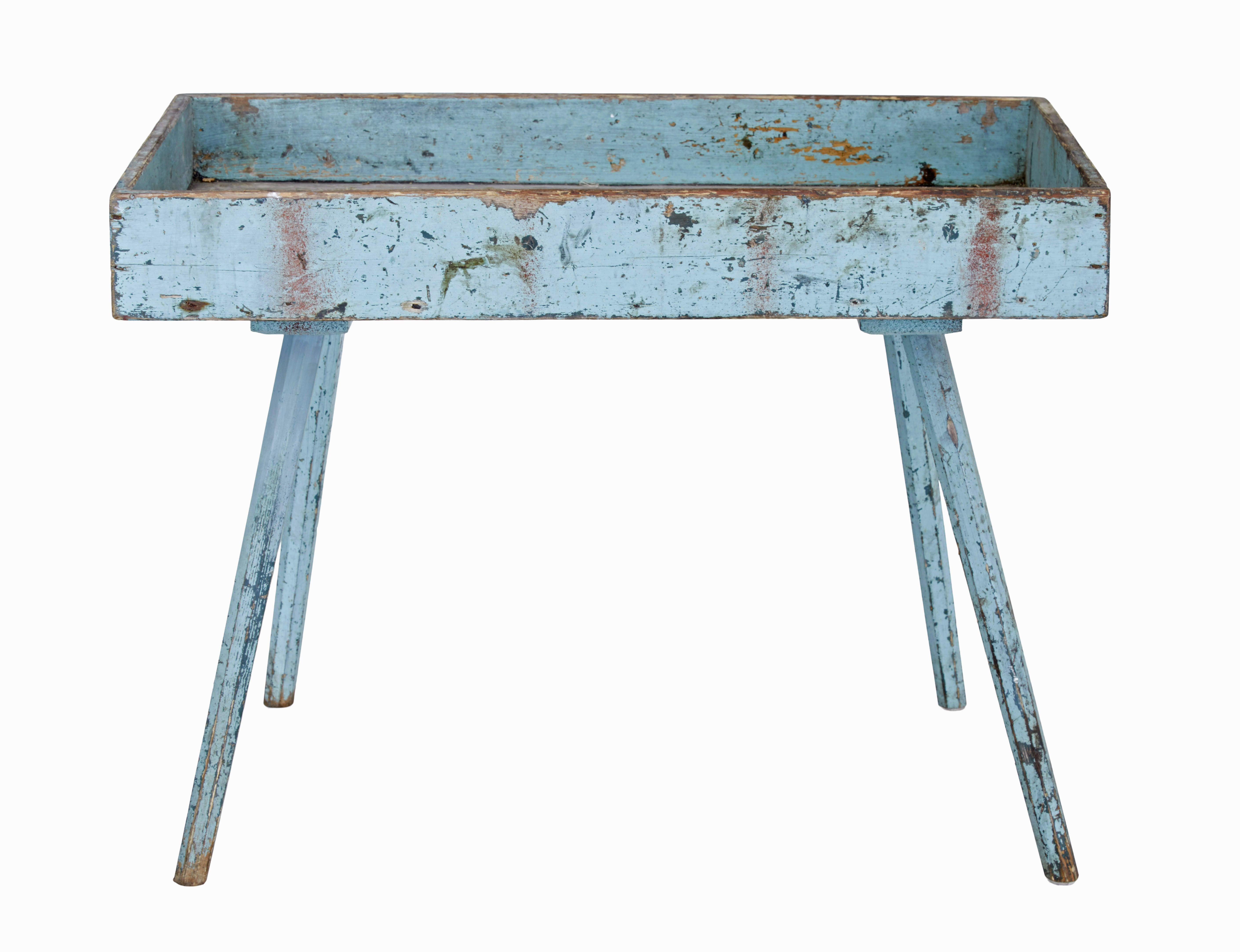 19th Century rustic painted pine garden room tray table circa 1880.

Scandinavian rustic table made from pine presented in original condition.  The table surface could be cleaned to use in the home as a side table.

Original paint which is now worn.