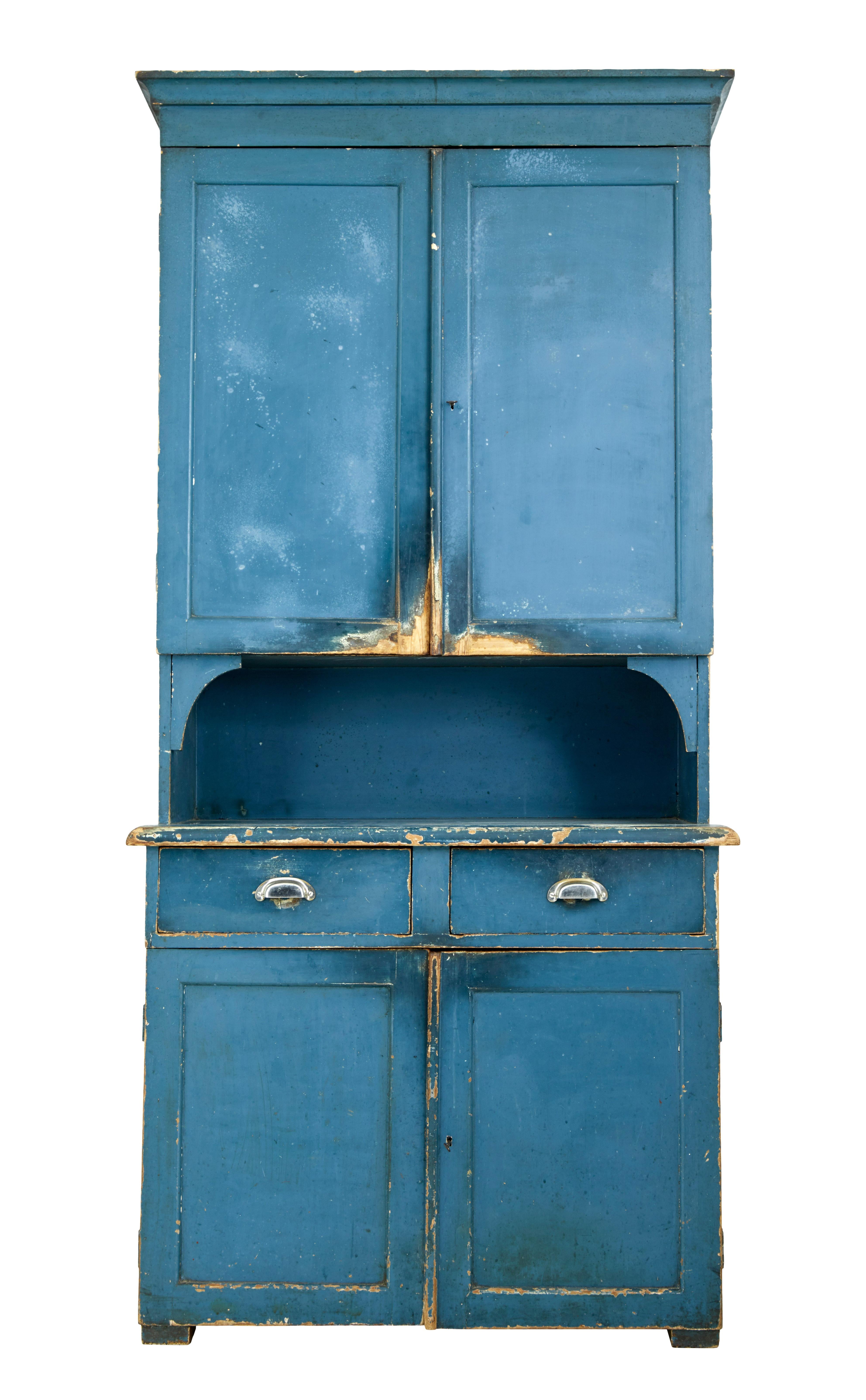 Striking kitchen cupboard, circa 1860.

Found in our travels around Sweden this piece is presented in its original colour scheme, which has now taken on a delightful faded appearance.

1 piece, double door top section with 2 fixed shelves,