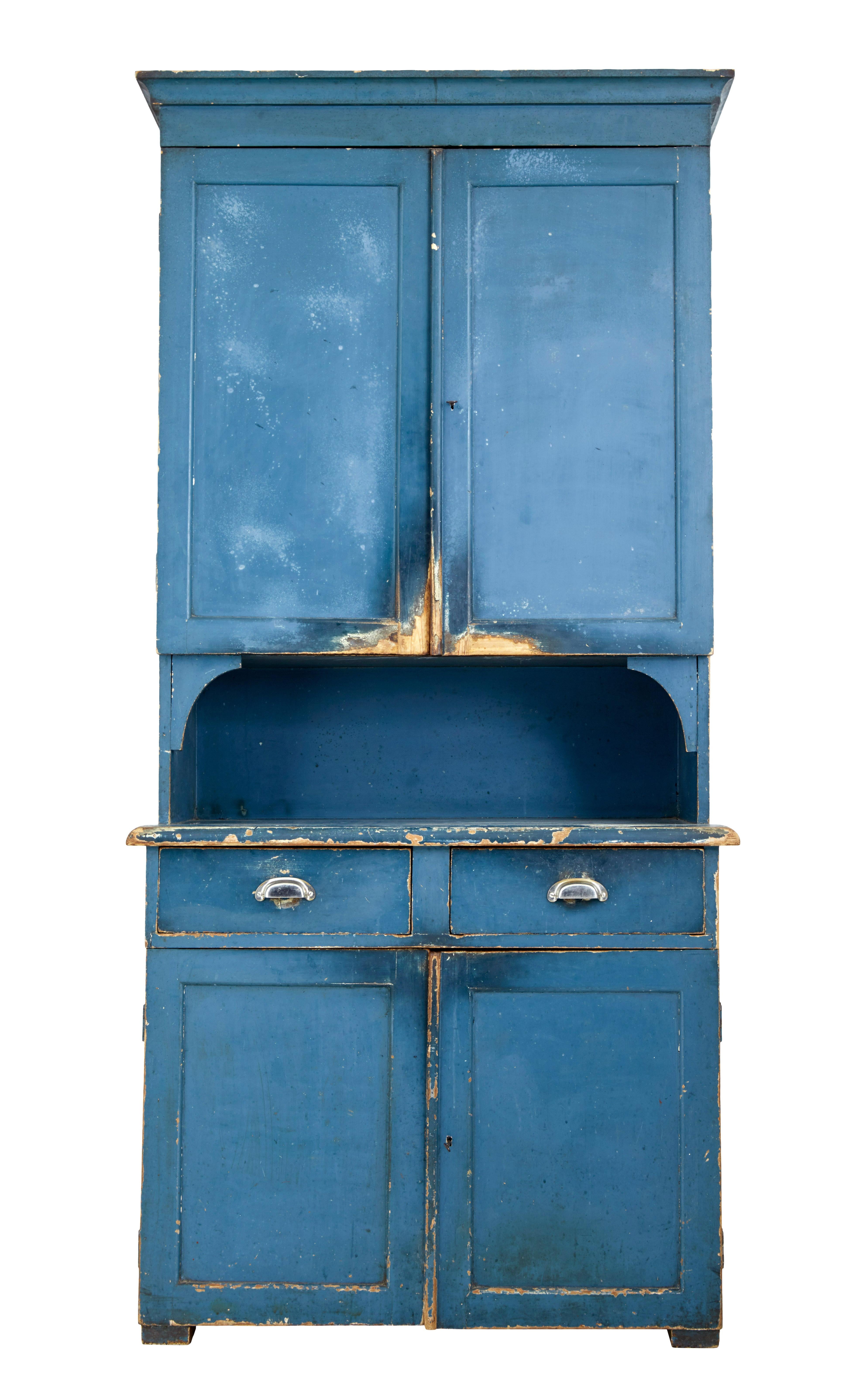 Striking kitchen cupboard circa 1870.

Found in our travels around Sweden this piece is presented in its original colour scheme, which has now taken on a delightful faded appearance.

1 piece, double door top section with 2 fixed shelves, stands