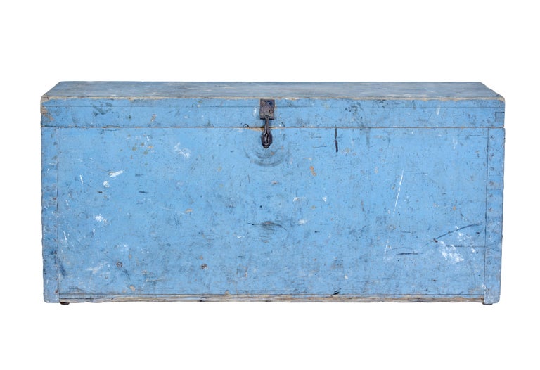 19th century swedish painted pine tool box circa 1890.

Rustic made tool box in it's original blue paint. Pine box with painted metalwork on the corners. Metal latch which allows it to be padlocked. Lid opens to reveal a partially fitted interior