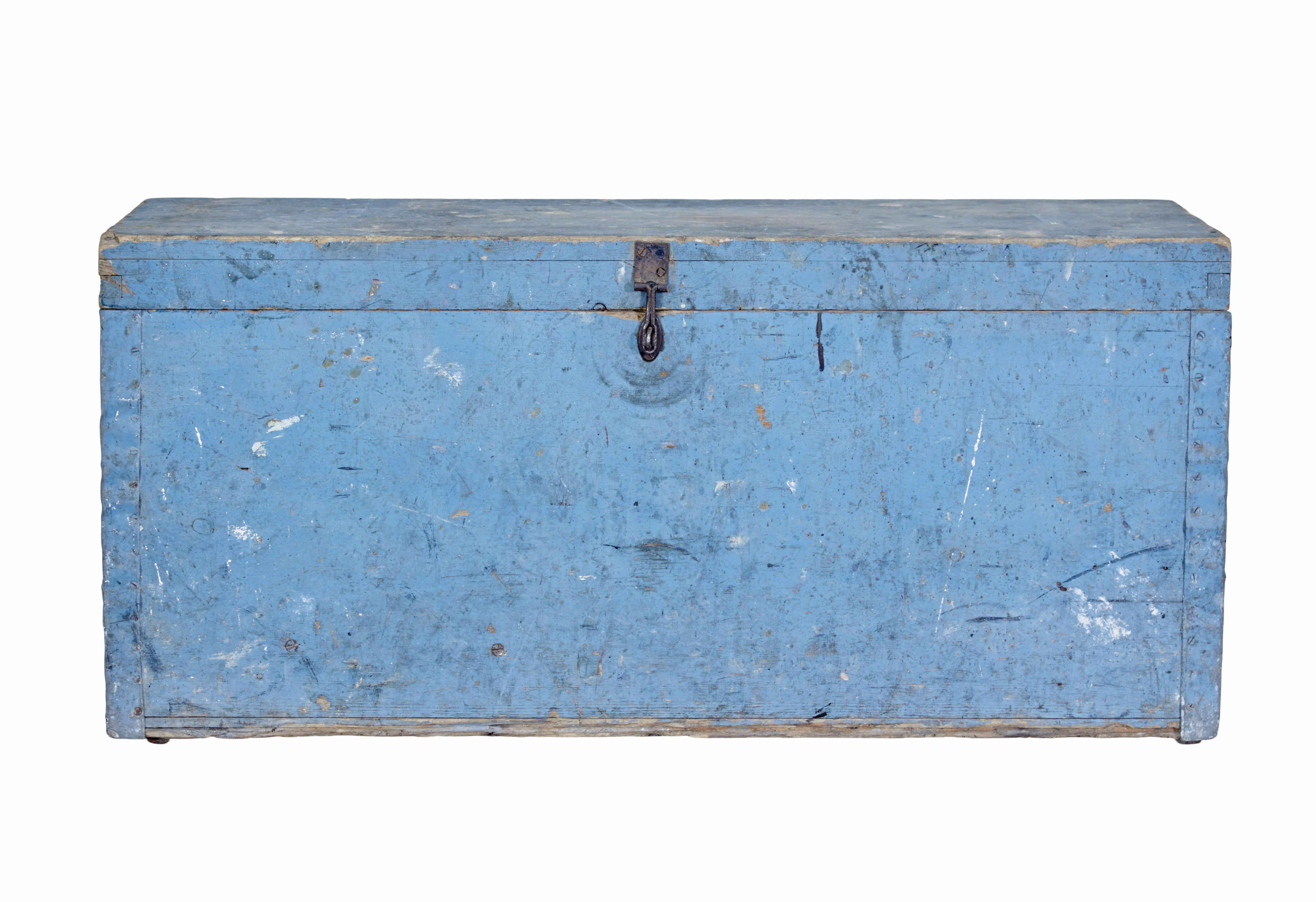 19th century Swedish painted pine tool box circa 1890.

Rustic made tool box in it's original blue paint.   Pine box with painted metalwork on the corners.  Metal latch which allows it to be padlocked.  Lid opens to reveal a partially fitted