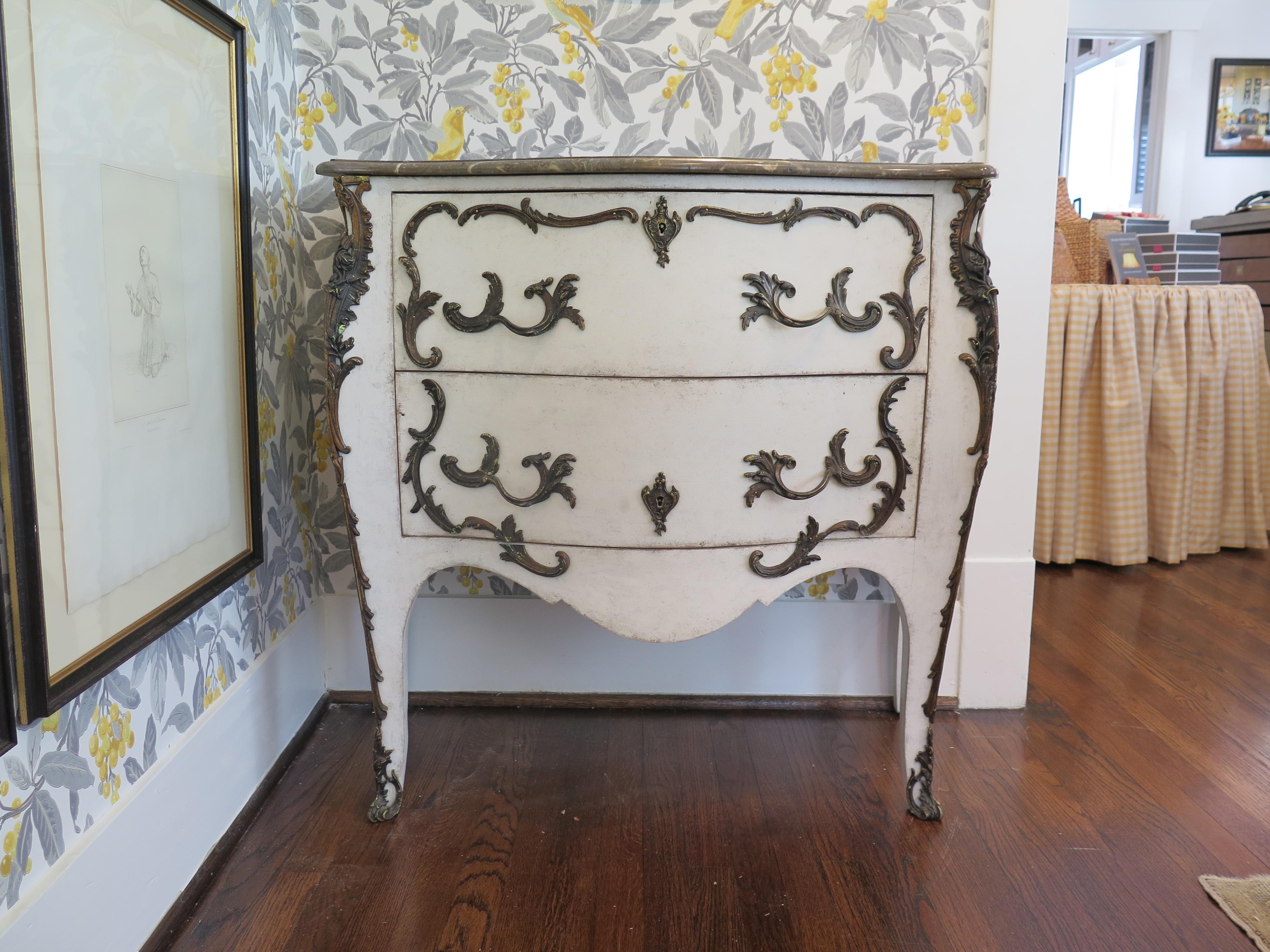 19th century Swedish painted Rococo commode with marble top and beautiful ormolu.