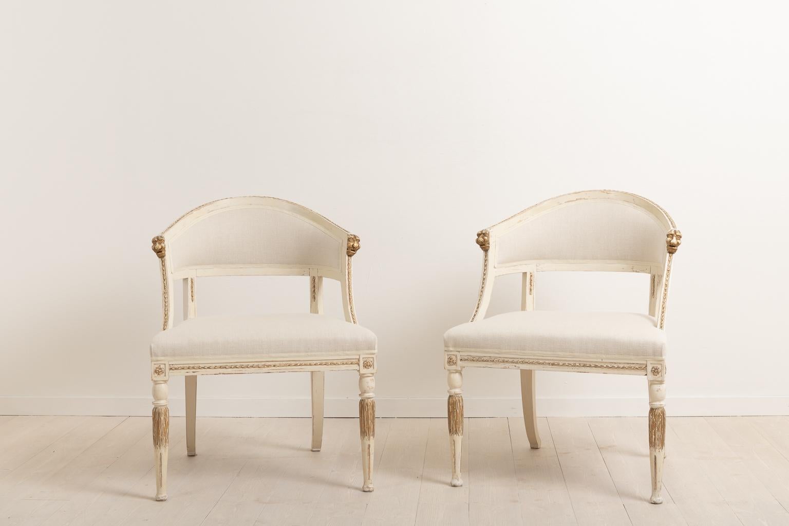 Set of two barrel back armchairs with renovated seats. The armchairs have renovated padding and have been upholstered with new fabric. Manufactured in northern Sweden circa 1880 the chairs are made in the Gustavian style, a style popular in Sweden