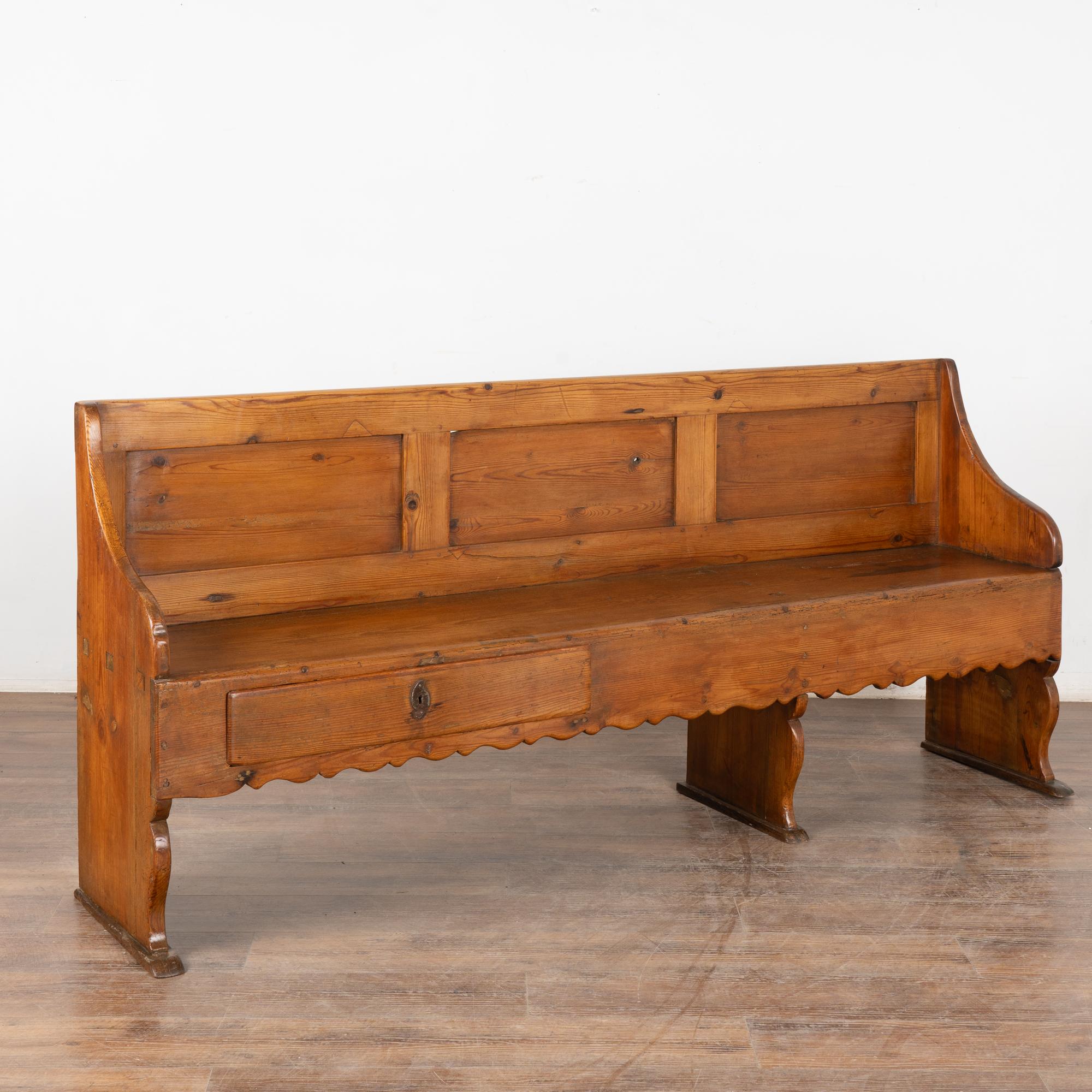 The years of use have deepened the warm patina of the pine, aging gracefully through the years. The decorative carving along the skirt add to its appeal.
Notice the two unique drawers, one small on the right end and a larger drawer along the left