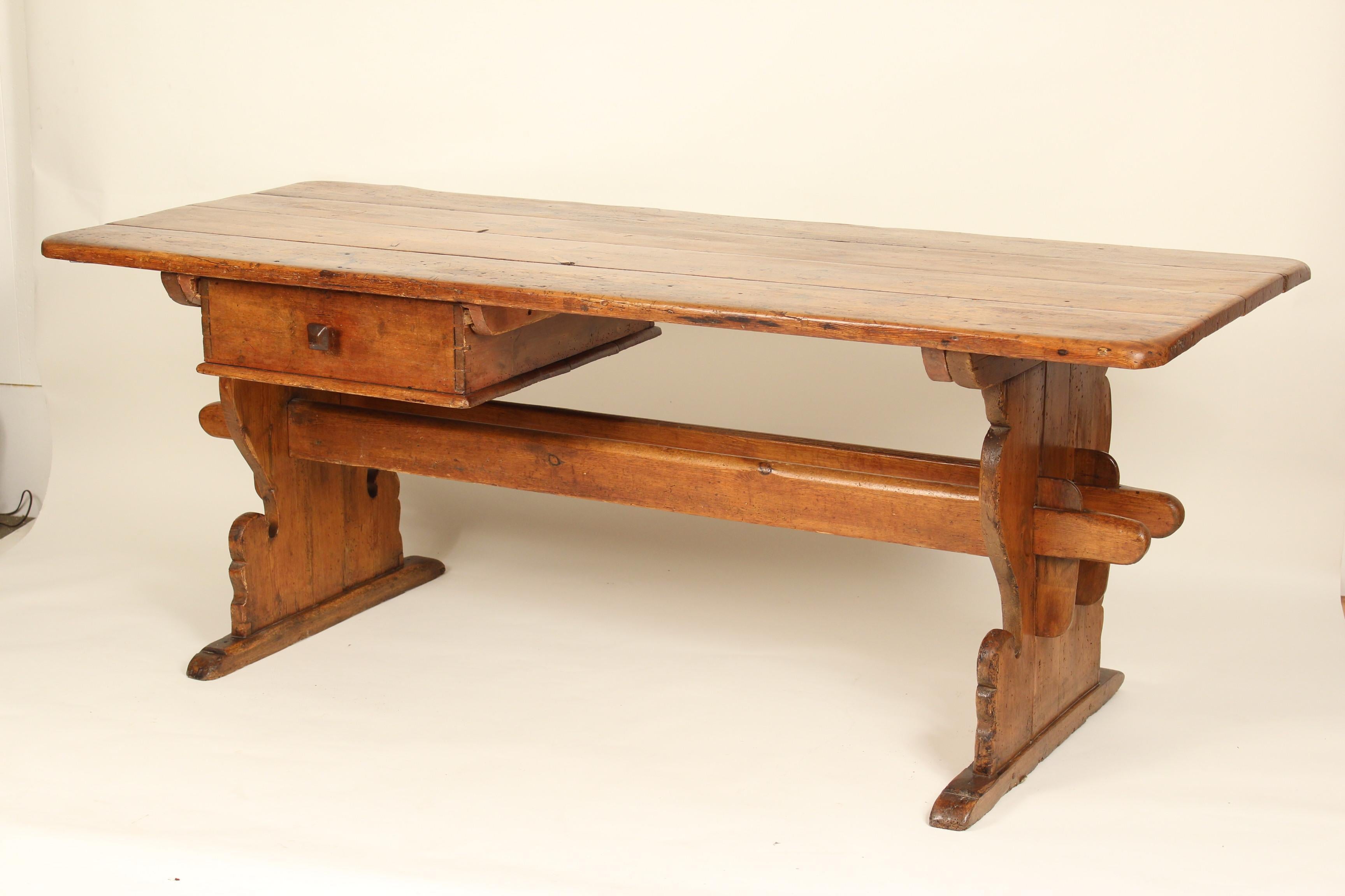 19th century Swedish pine trestle form dining room table. This table has an excellent old patina.