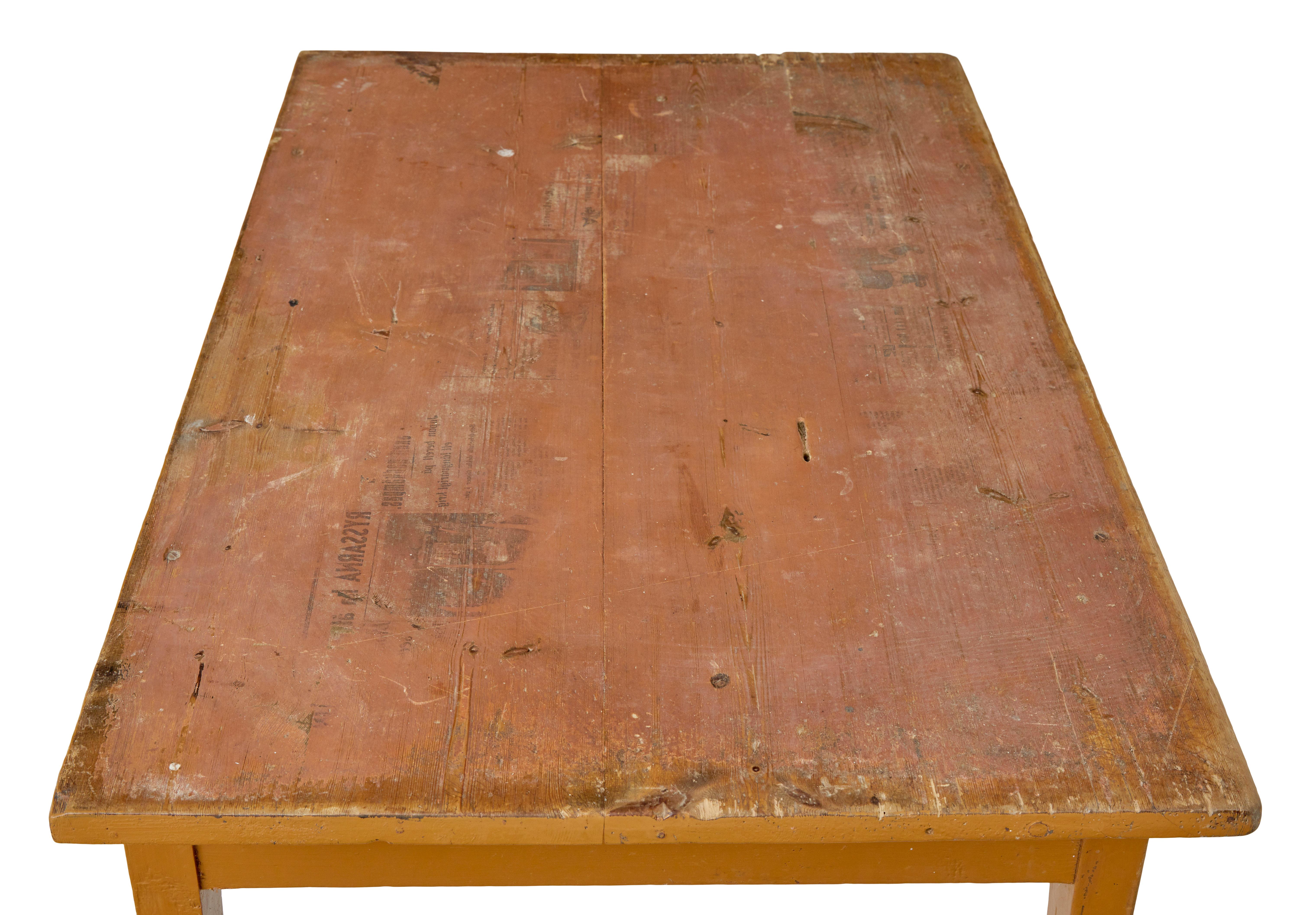19th century Swedish pine painted table circa 1890.

Rectangular top which interestingly has a the impression of newspaper on the top surface.  This could be removed if desired.  Single drawer below the top surface.  Standing on 4 tapered legs to
