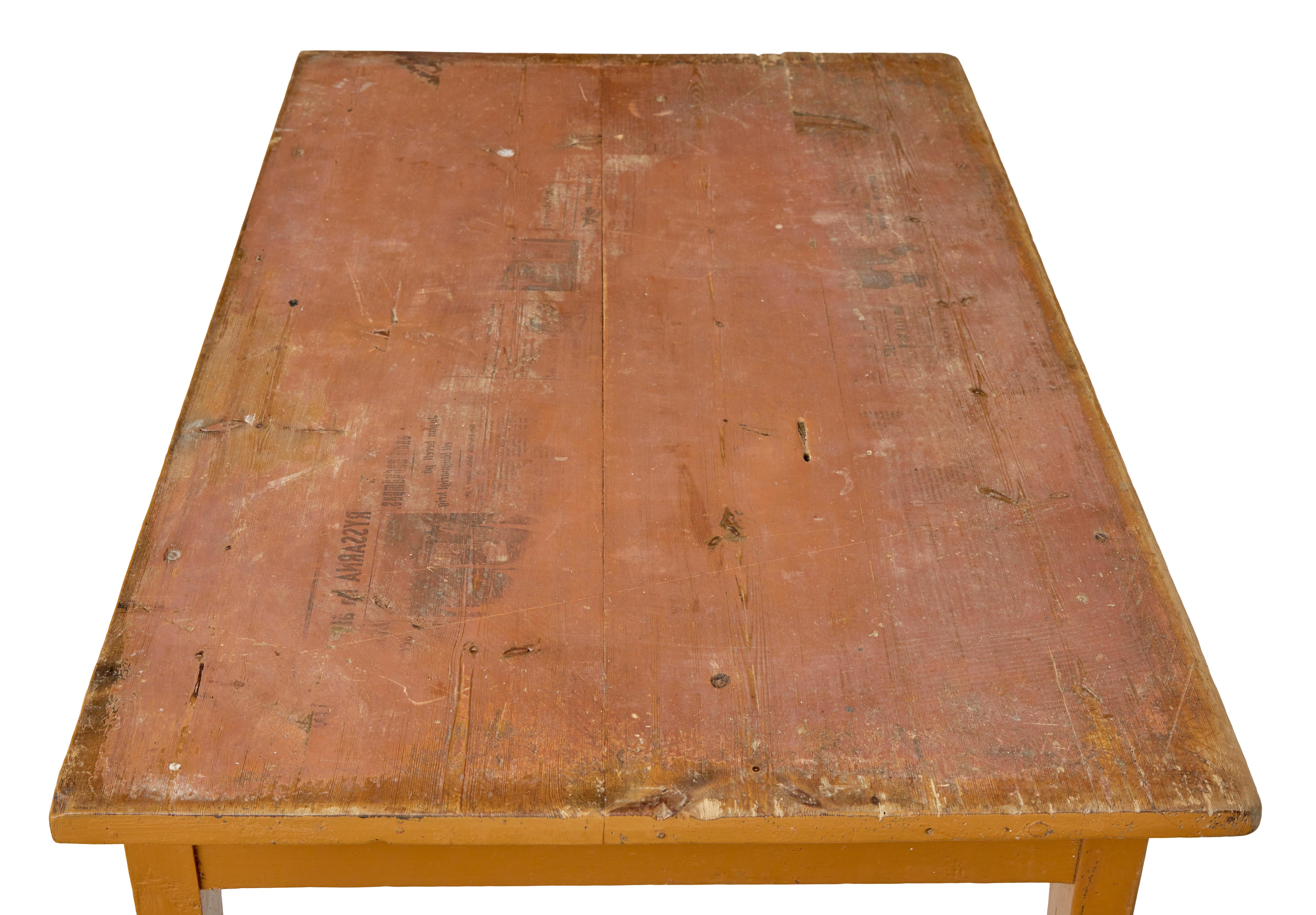 19th century Swedish pine painted table circa 1890.

Rectangular top which interestingly has a the impression of newspaper on the top surface.  This could be removed if desired.  Single drawer below the top surface.  Standing on 4 tapered legs to
