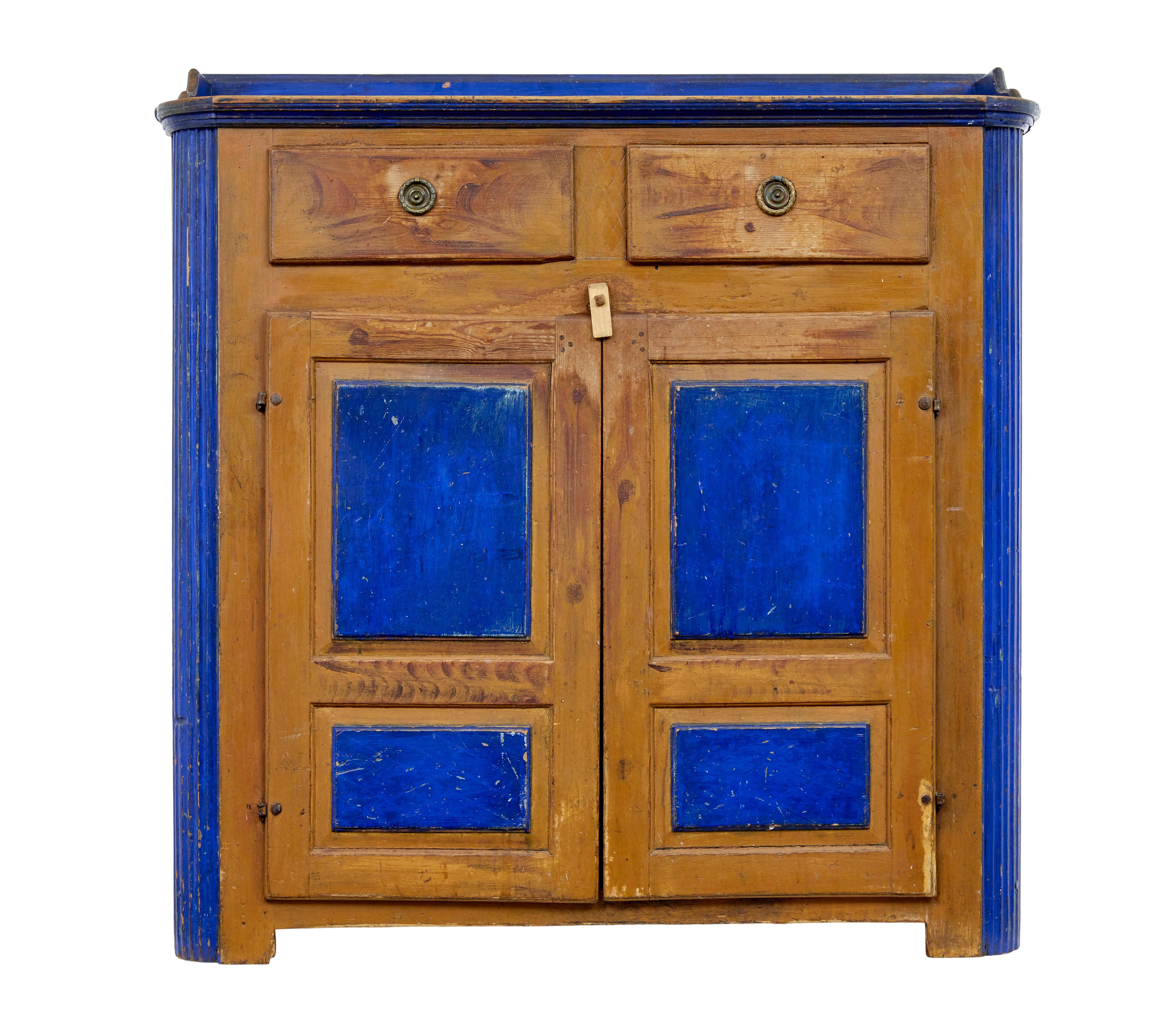 19th century Swedish pine painted kitchen cupboard circa 1880.

Rare and good quality pine sideboard come dresser base. Painted with a cobolt blue scheme to the top, door panels and sides.

Top with gallery with top drawers below. Double door