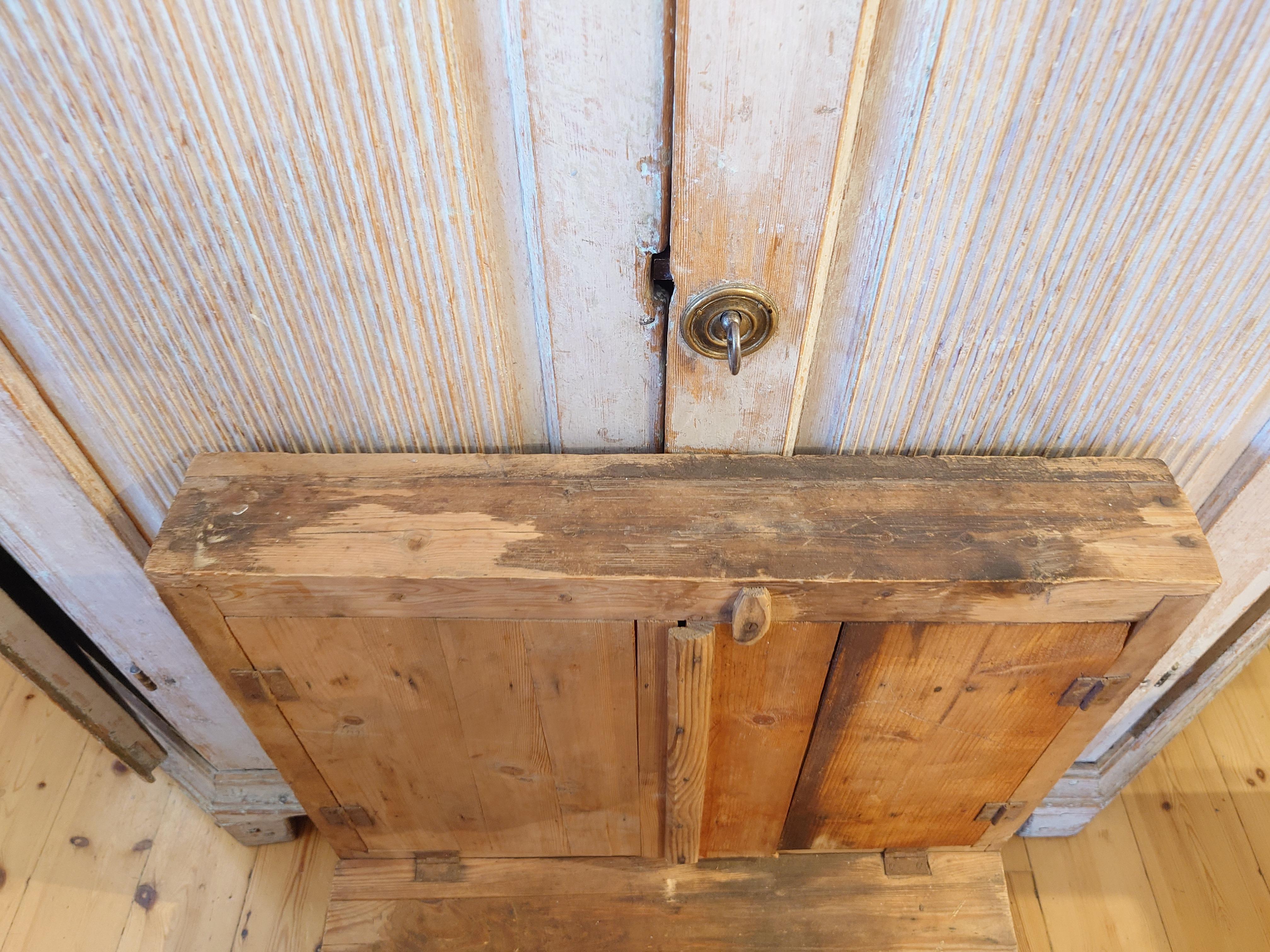 Hand-Carved 19th Century Swedish pine rustic hanging cabinet for working tools For Sale