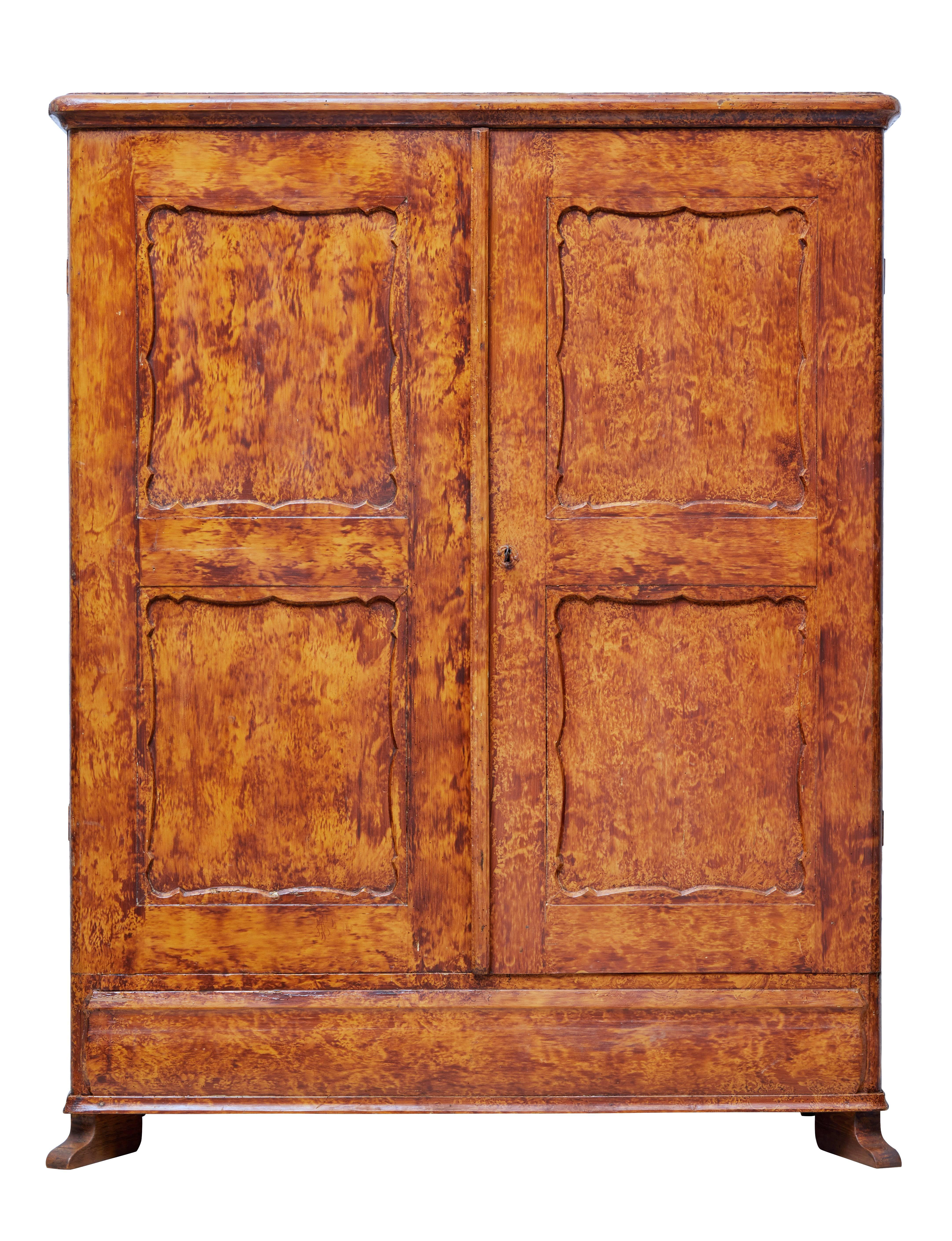 Good quality traditional Swedish cupboard, circa 1870.

Presented in its original ragwork paint effect. Double doors open to reveal a partially fitted interior which indicates this was being used as a wardrobe.

Two shelves and four drawers,