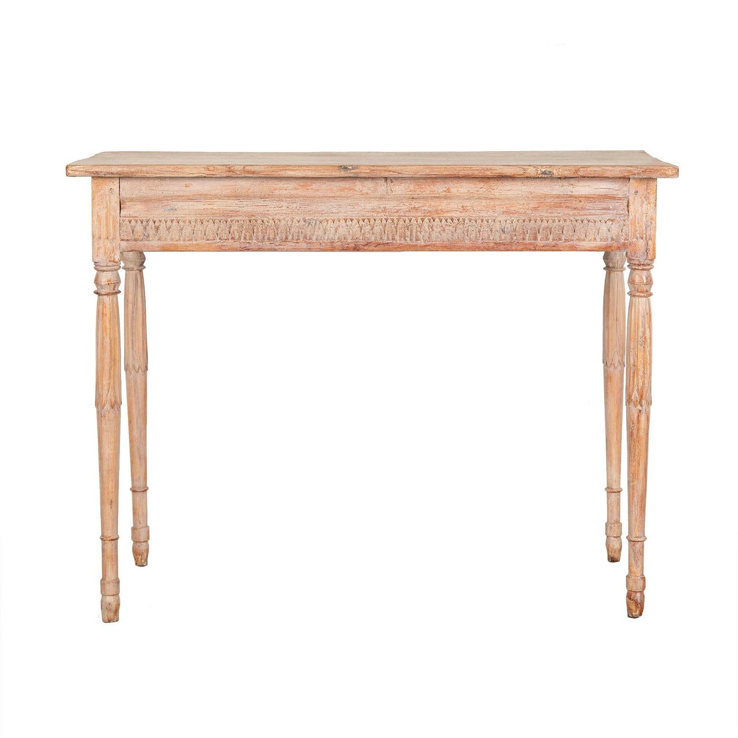 19th century Swedish table with four turned legs with leaf decoration. This piece features decorative carving around the table on all four sides, and original paint. This table could free stand.