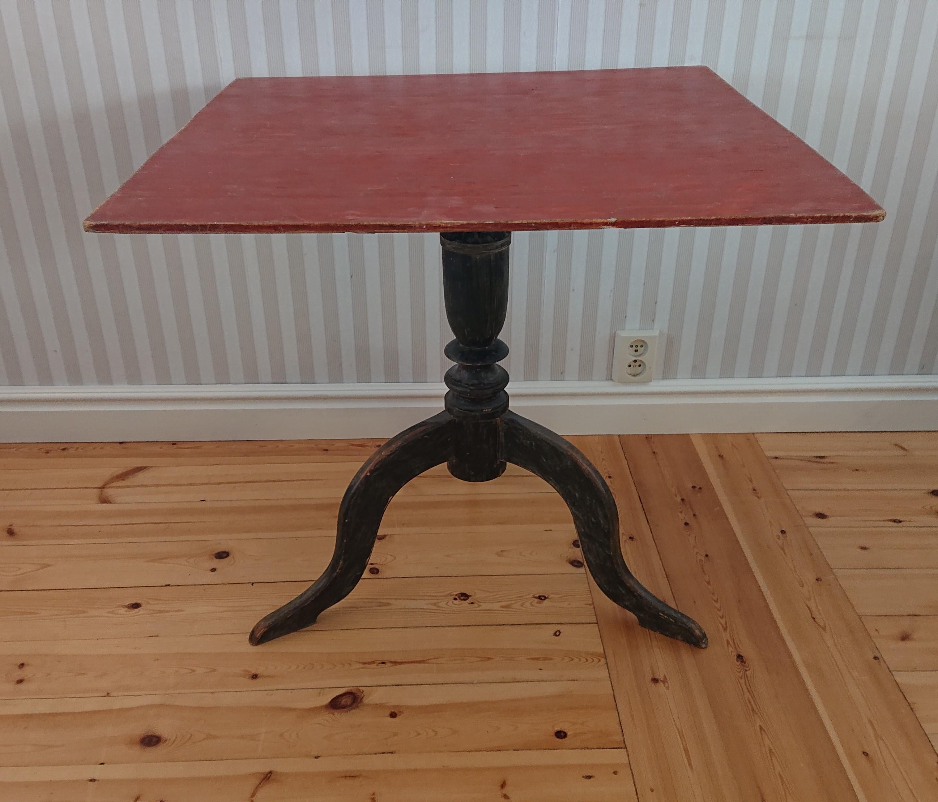 19th Century Swedish Tilt Top table from Skellefteå Västerbottem, Northern Sweden.
 Beautiful table scraped by hand to its well preserved original paint.
Turned base supported by beautifully carved legs.
Good antique condition with minor historic