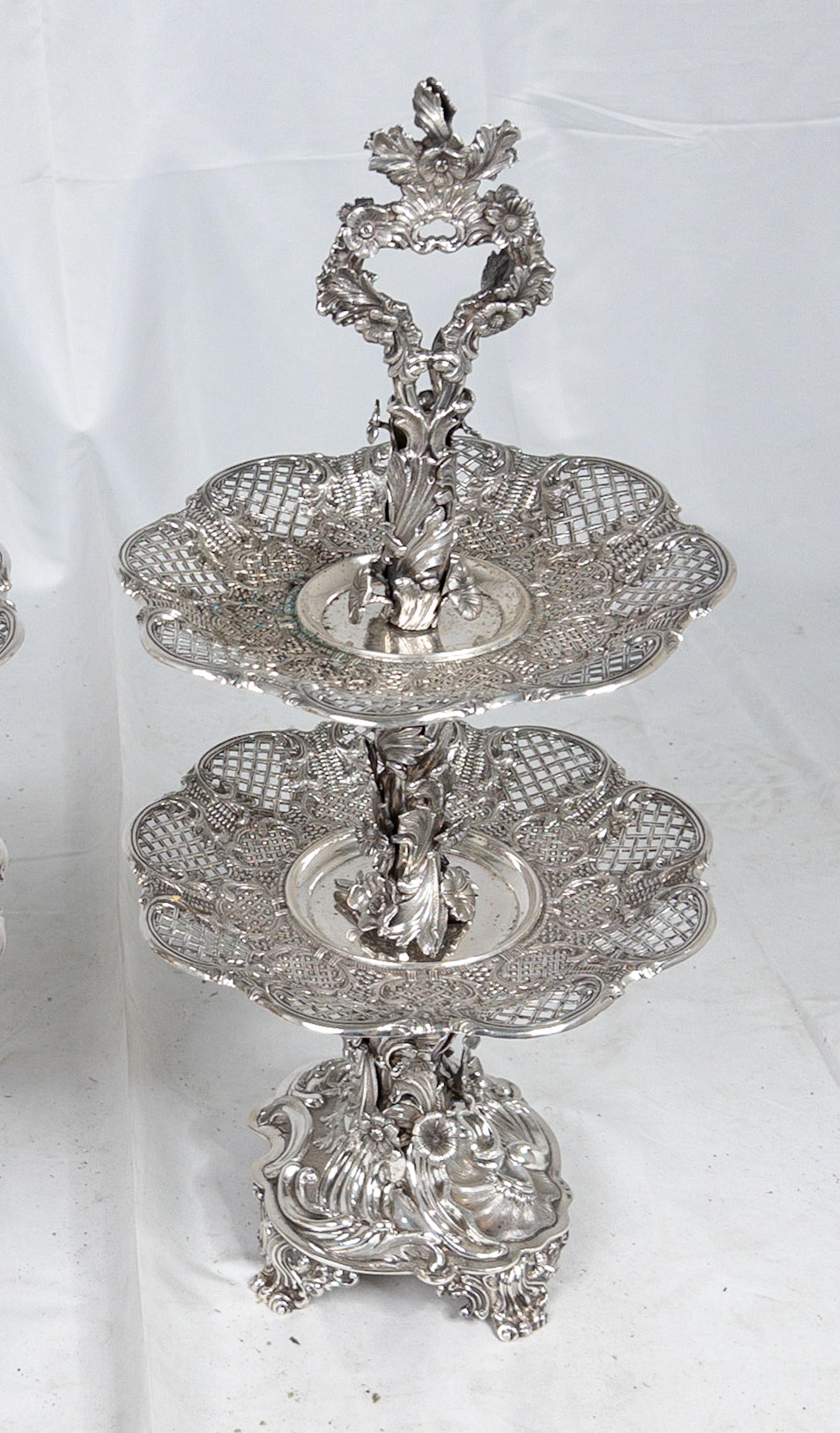 19th Century Swedish two-tiered sterling slver dessert stand, created by silversmith Gustaf Möllenborg and presenting a floral and foliage décor. This unusual server is from Sweden and made in 1848 (Stamped S4). We have included clear pictures of