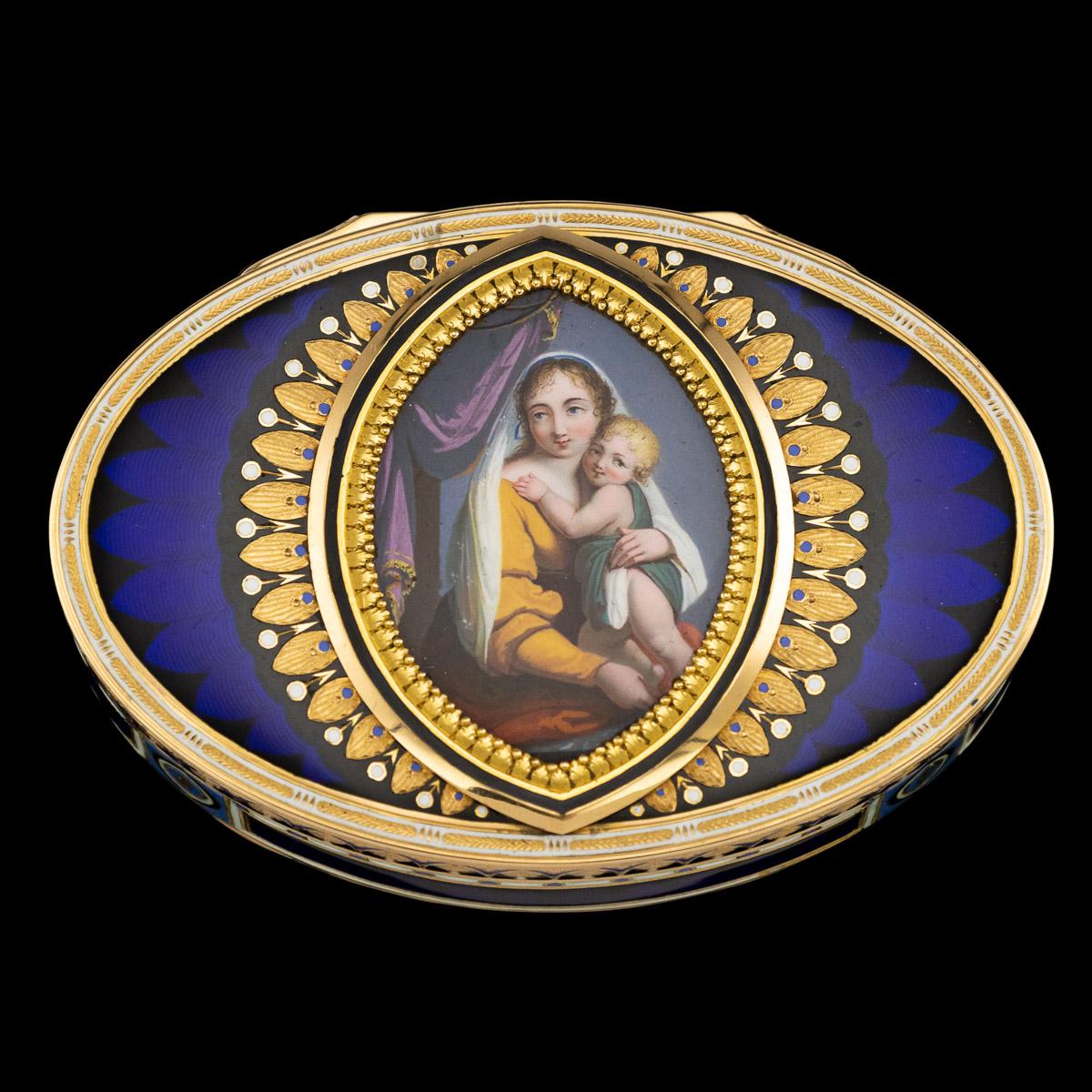 Antique early 19th century Swiss 18-karat gold snuff box, the lid set with a marquise shaped panel delicately hand painted depicting holly mother and child surrounded by an engraved laurel leaf boarder and a large boarder with ovals and arrows,