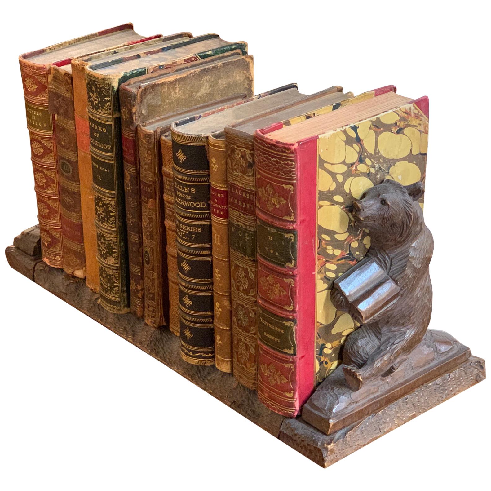 19th Century Swiss Black Forest Book Ends with 11 Antique Books For Sale