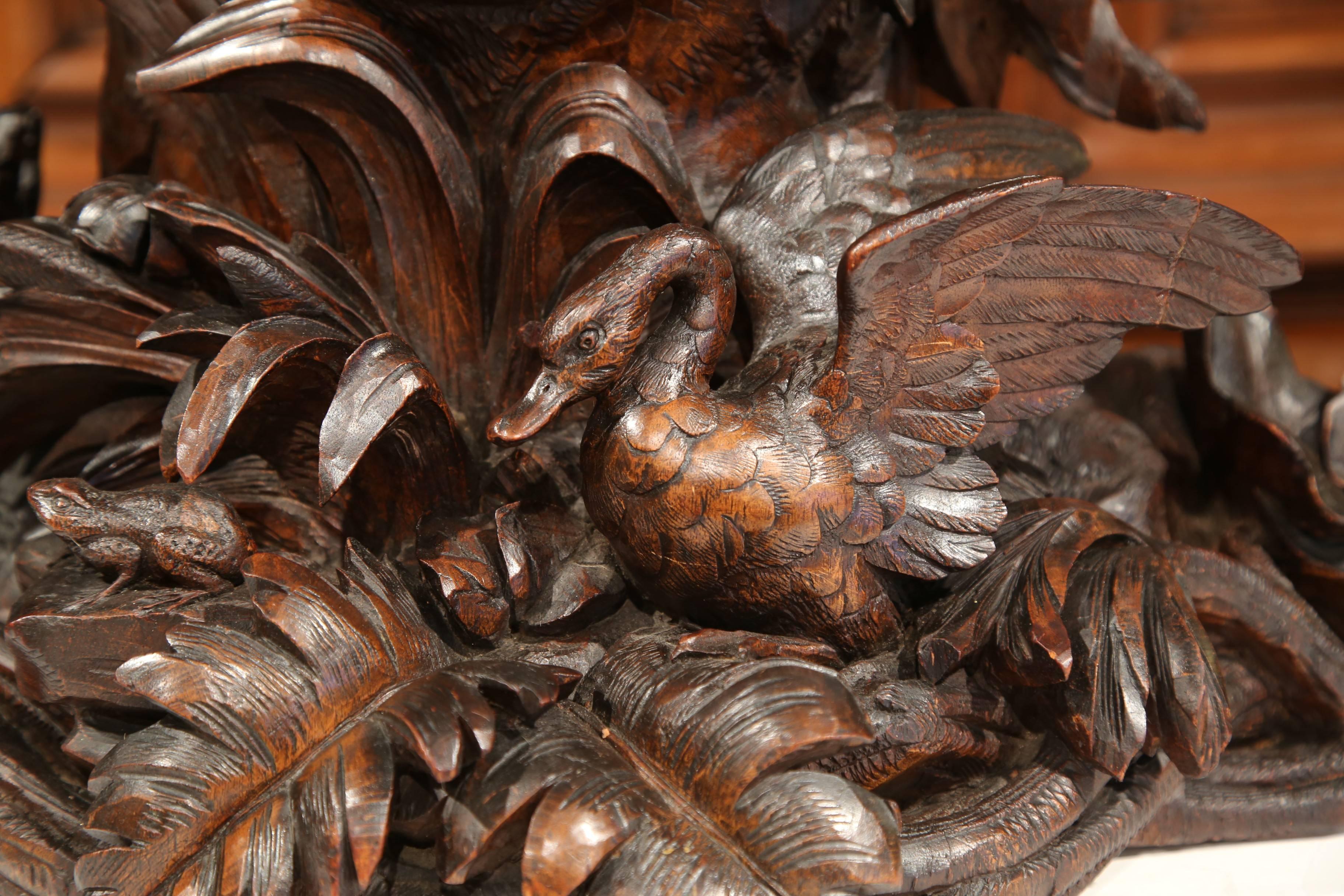 Hand-Carved 19th Century Swiss Black Forest Carved Walnut Mantel Clock with Cherubs and Bird For Sale