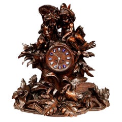 19th Century Swiss Black Forest Carved Walnut Mantel Clock with Cherubs and Bird