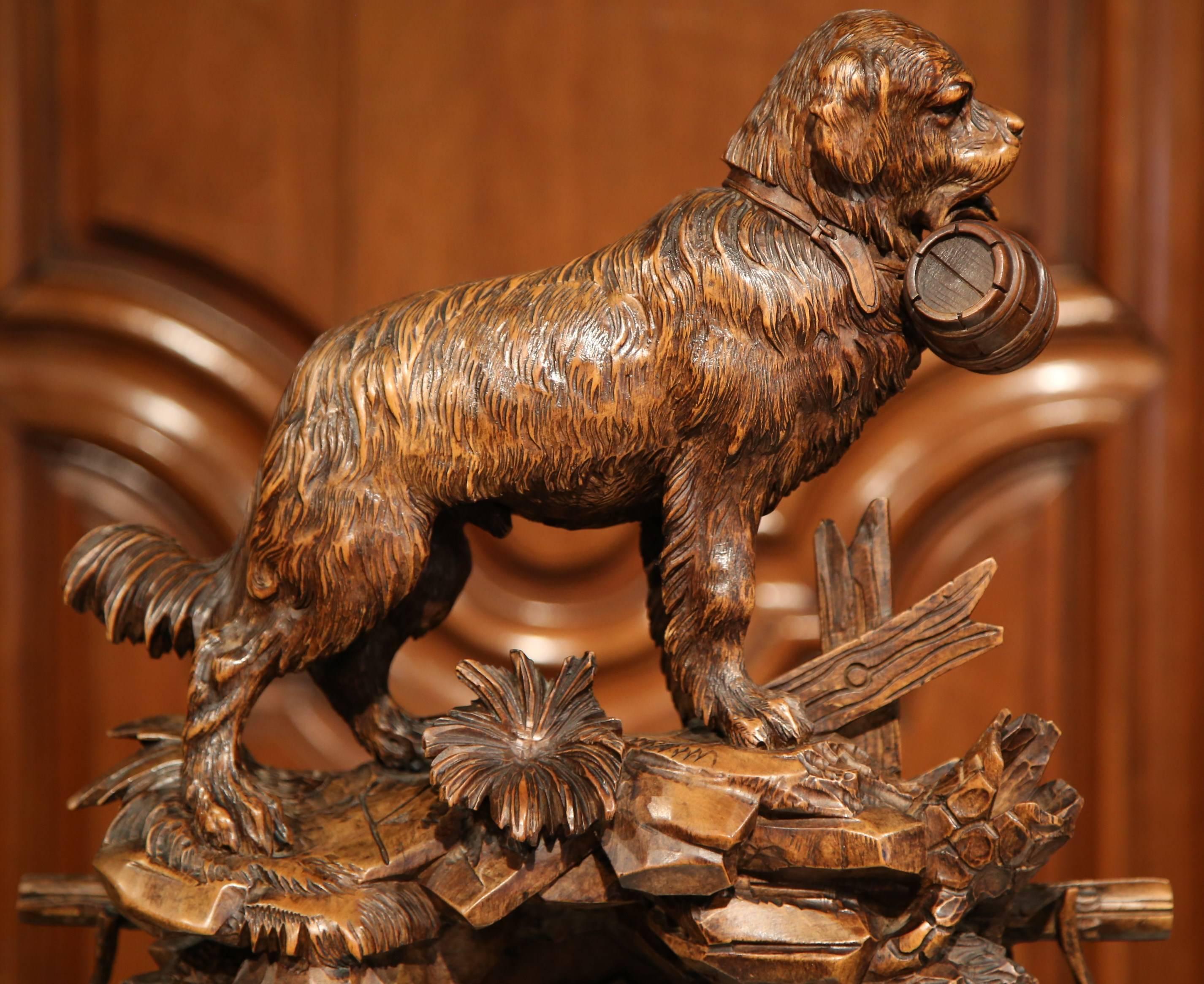 This monumental three-piece carved fruitwood cuckoo clock garniture set was carved in Switzerland, circa 1870, making it perfect for a mantel in the living room. The central timepiece features a beautiful rescue Saint Bernard dog at the pediment