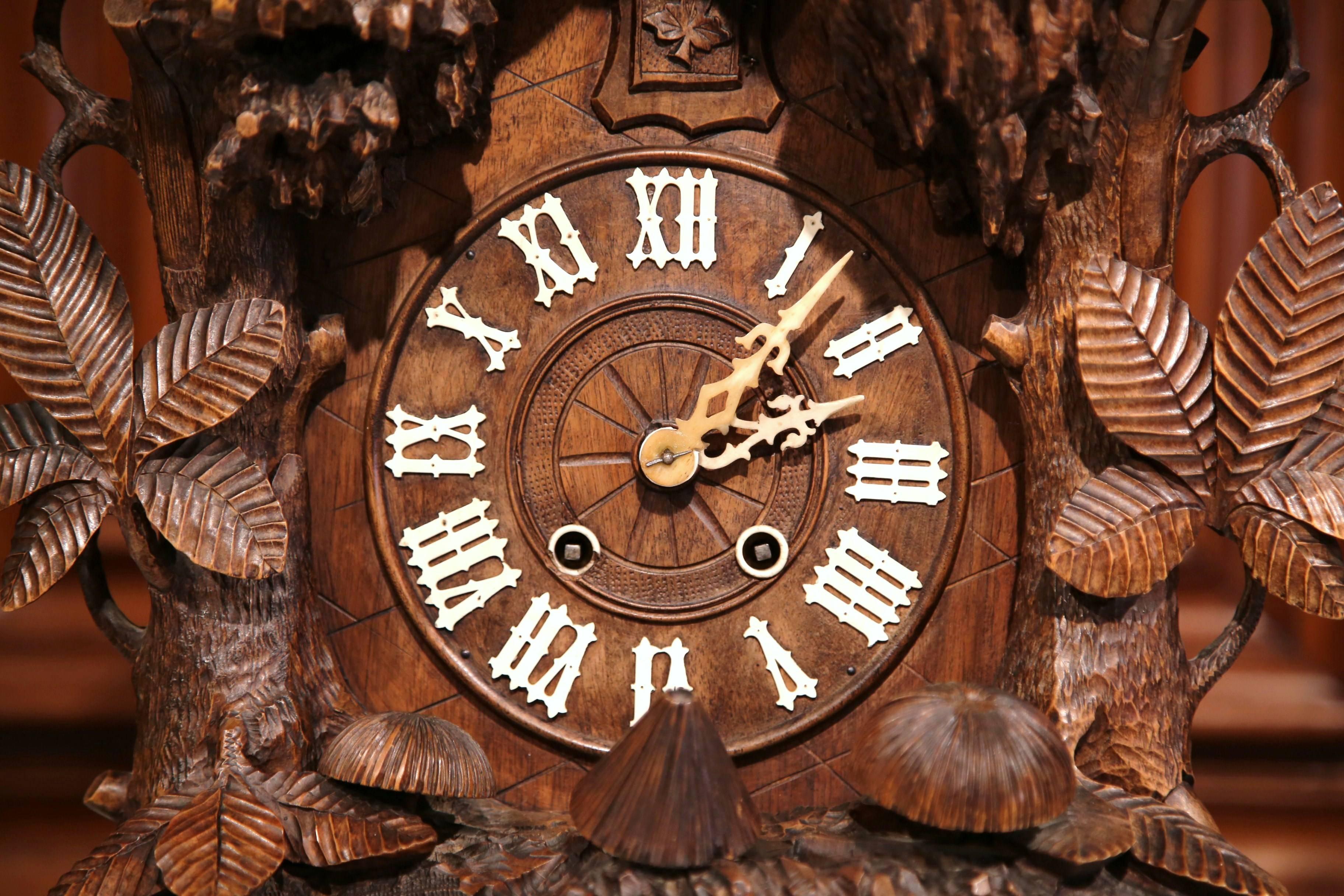 Hand-Carved 19th Century Swiss Black Forest Carved Walnut Three-Piece Mantel Clock Set