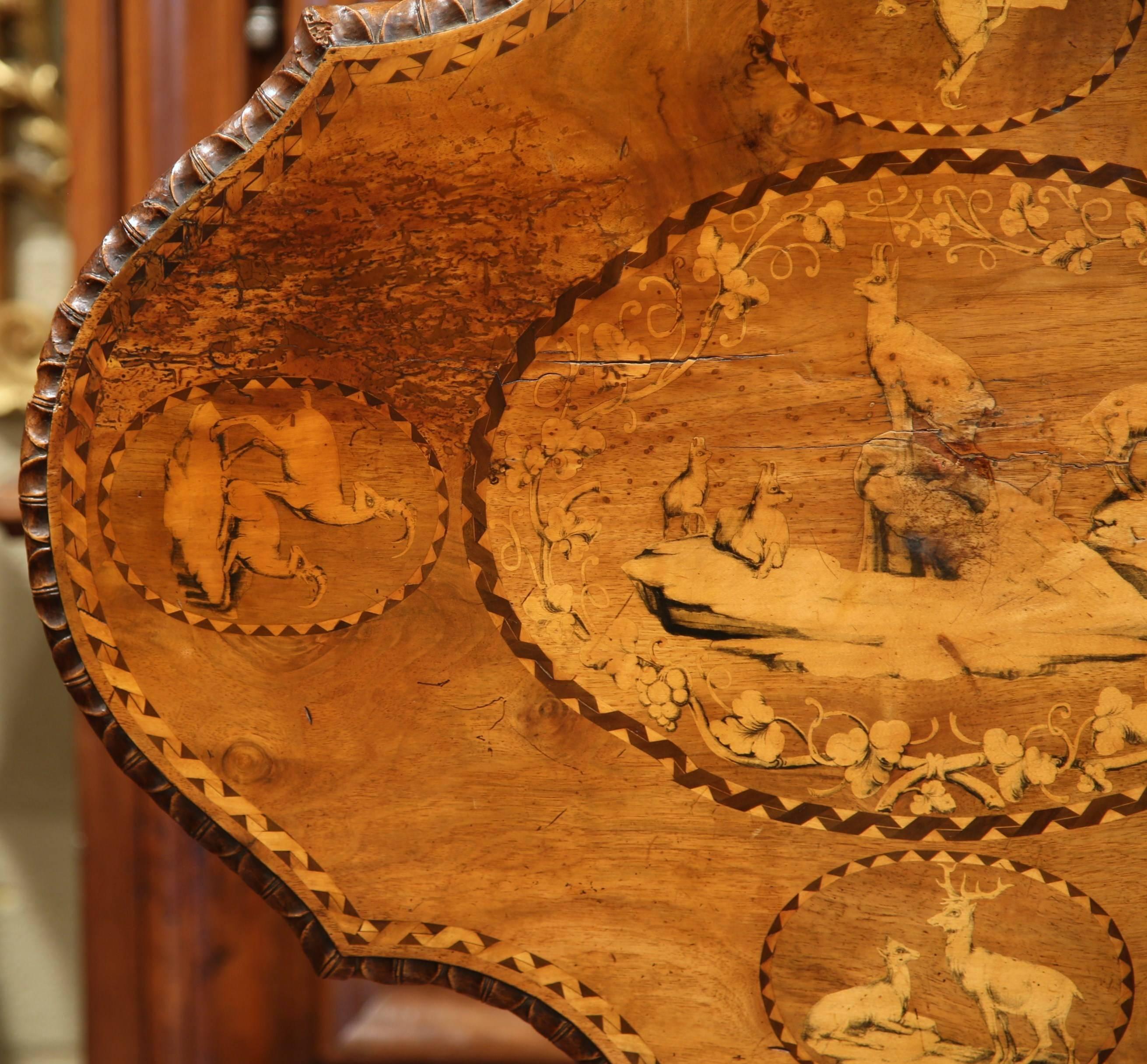 19th Century Swiss Black Forest Carved Walnut Tilt-Top Table with Hunt Scenes 4