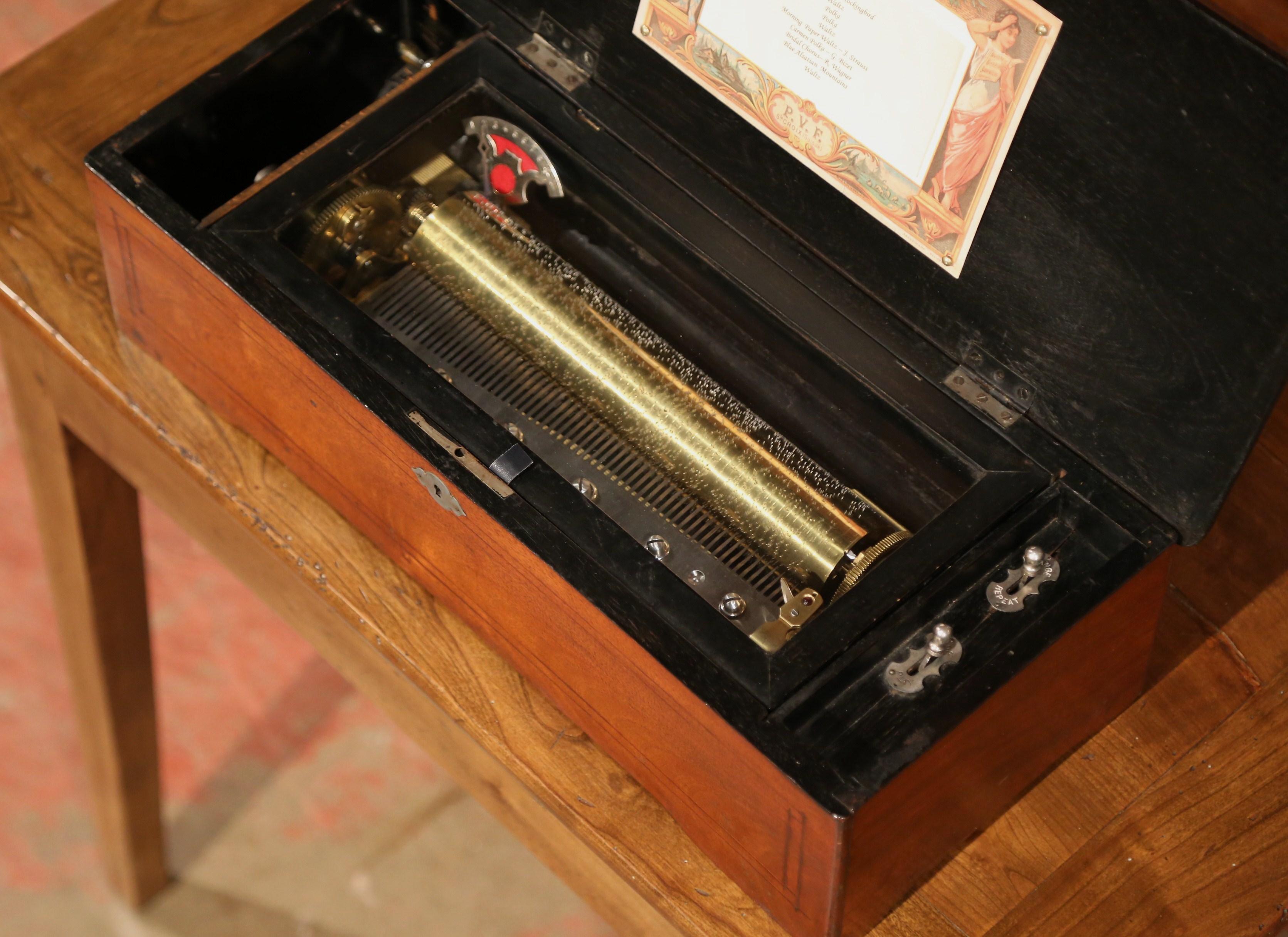 Hand-Carved 19th Century Swiss Wood Inlaid and Ebonized Cylinder Music Box with Ten Songs