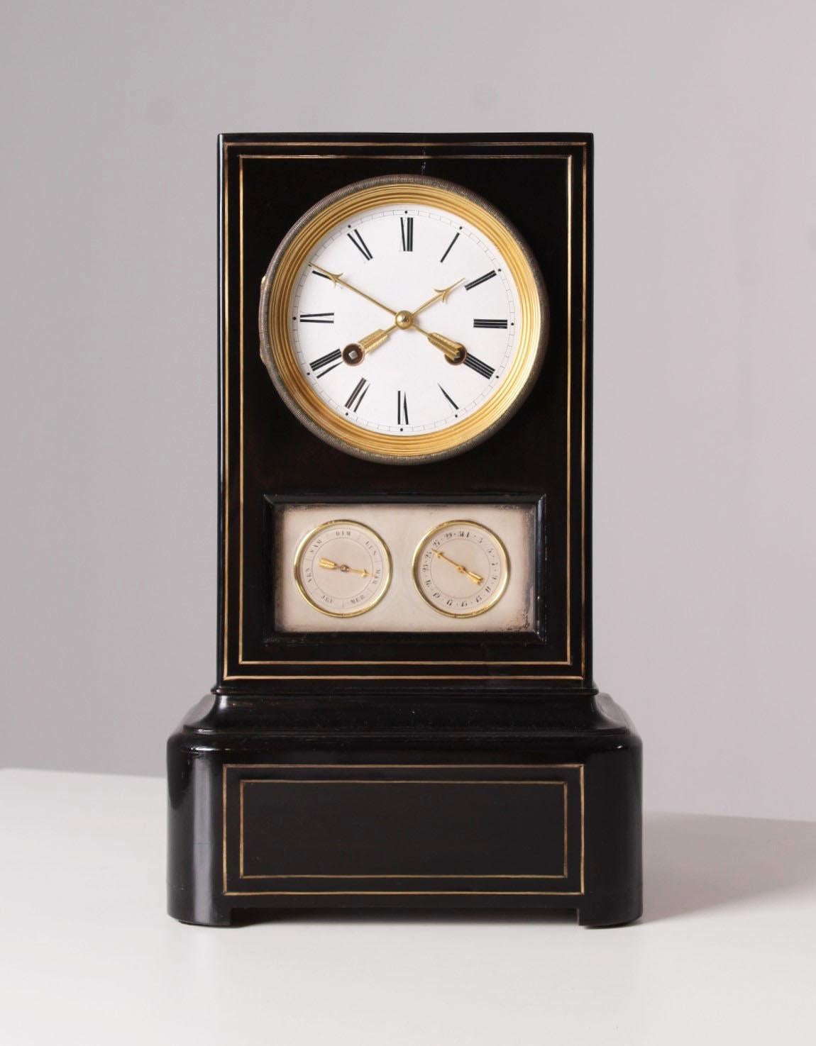 Antique mantel clock with calendar in ebonised wood.

France
Wood, brass
Mid 19th century

Dimensions: H x W x D: 37 x 22 x 17 cm

Description:
French mantel clock from around 1840-1860.

The case is made of ebonised wood with brass