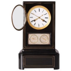 Orologio da tavolo del XIX secolo con calendario, legno ebanizzato, Francia, circa 1840-1860