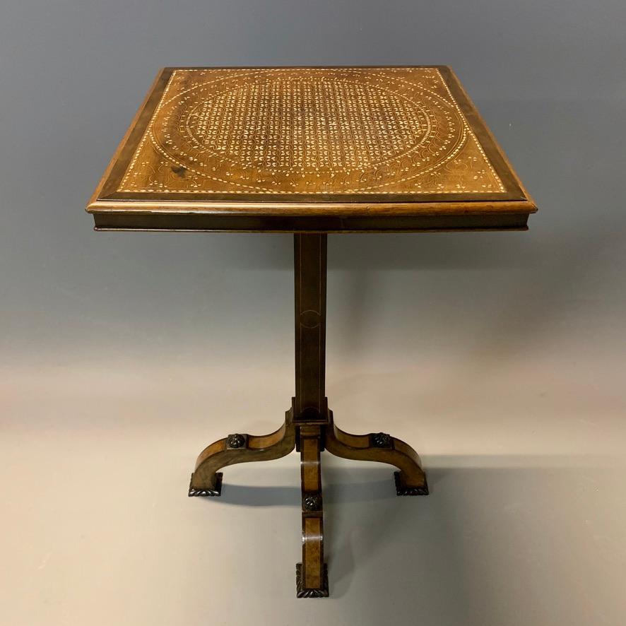 This is an exceptionally good quality and beautifully made side or occasional table, certainly in the manner of Gillows or perhaps Edwards & Roberts circa 1890.
The table is in rosewood and ebony, beautifully inlaid with mother of pearl and