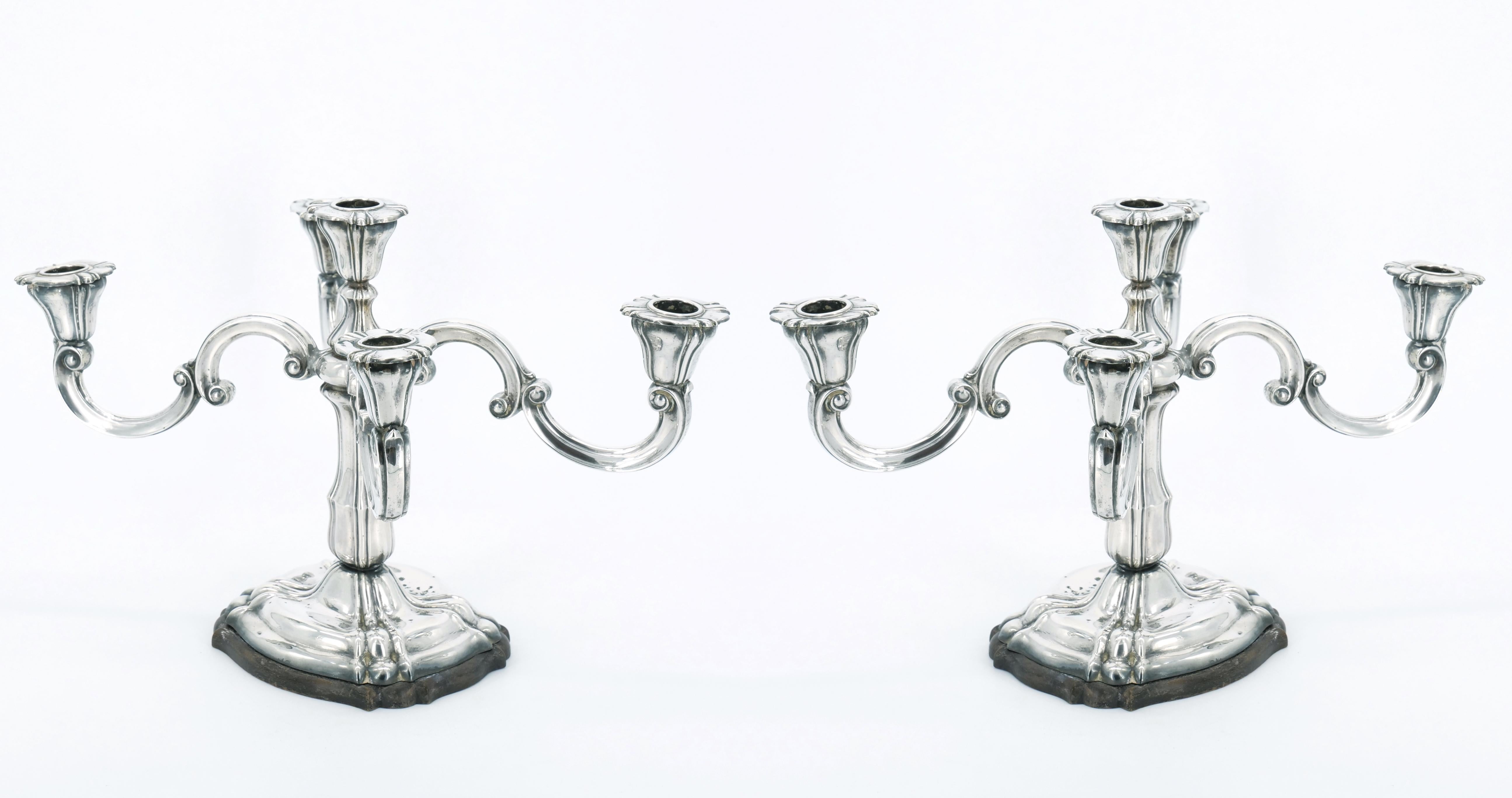 Step back in time with our exquisite 19th Century Italian Tableware Sterling Silver Five-Arm Candelabra, gracefully paired with a sturdy wood base. This antique treasure is a testament to the timeless allure of Italian craftsmanship, combining