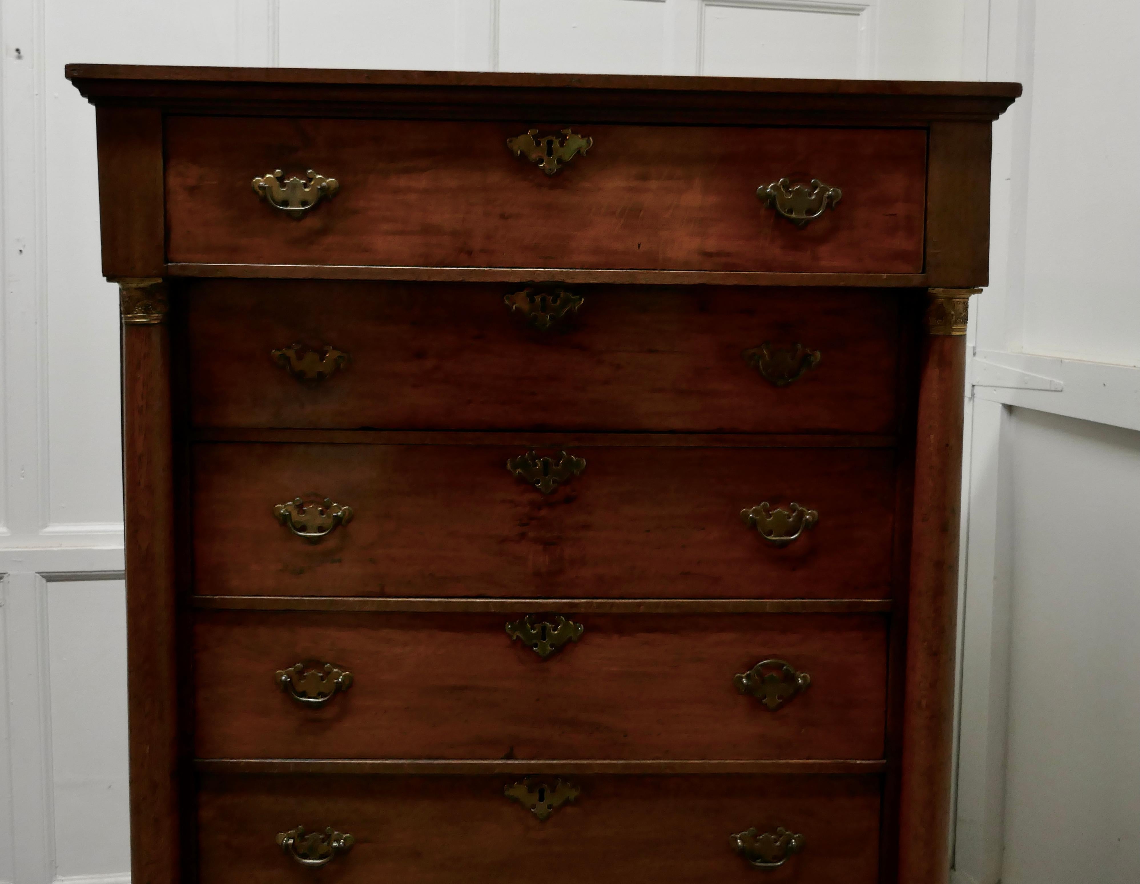 19th century tall 6 drawer oak chest of drawers 

This is a superb oak chest of drawers it is unusual and very desirable style of 6 full width drawers
The chest has slender columns on each side set with ormolu mounts 
The drawers have brass swan