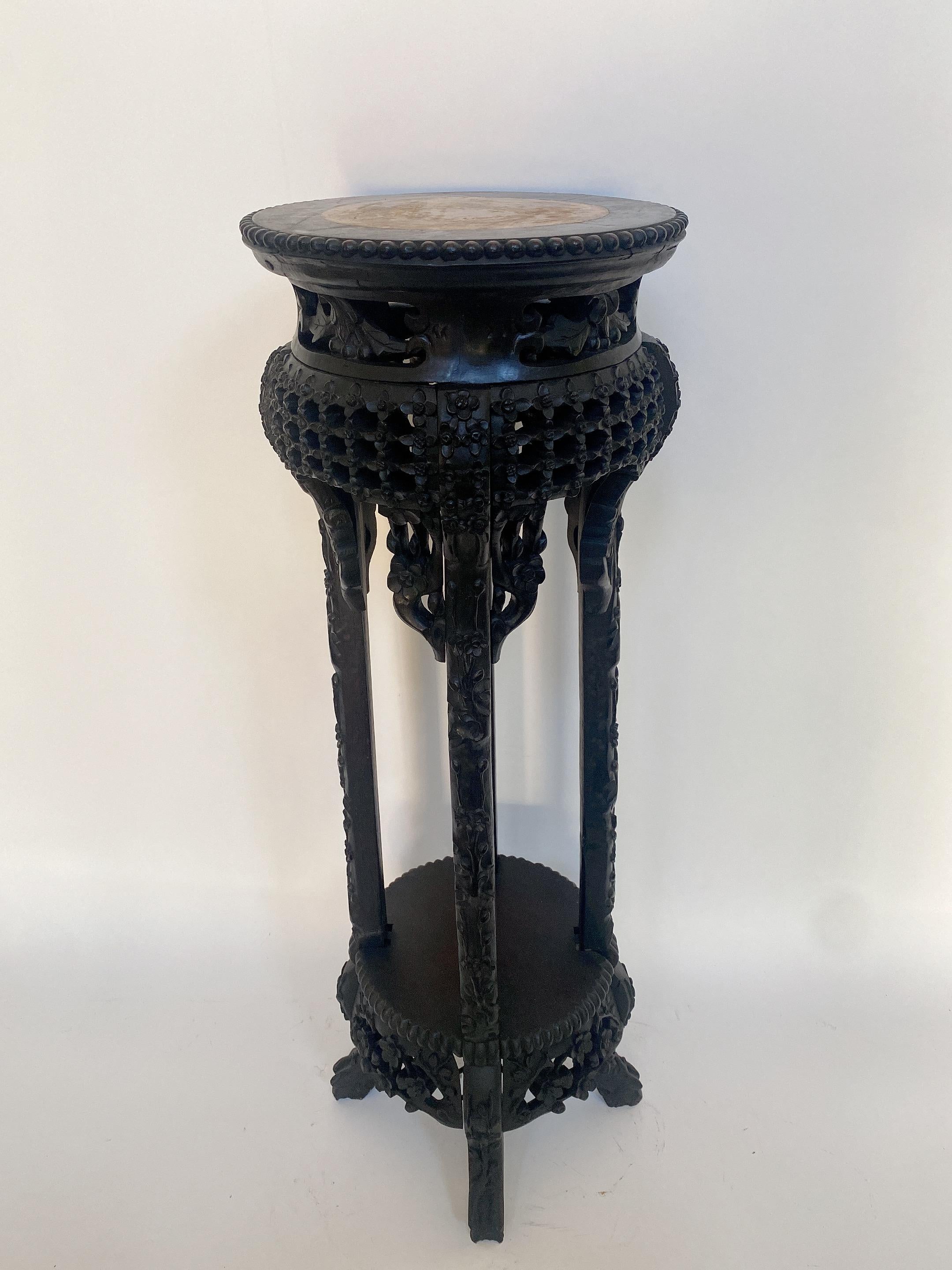 A 19th century antique tall Chinese heavily carved hardwood circular stand table with rouge marble top insert, the inset marble top over carved hardwood apron with beaded trim, fancy caved legs with lower shelf, dimensions: 34'' inches height x