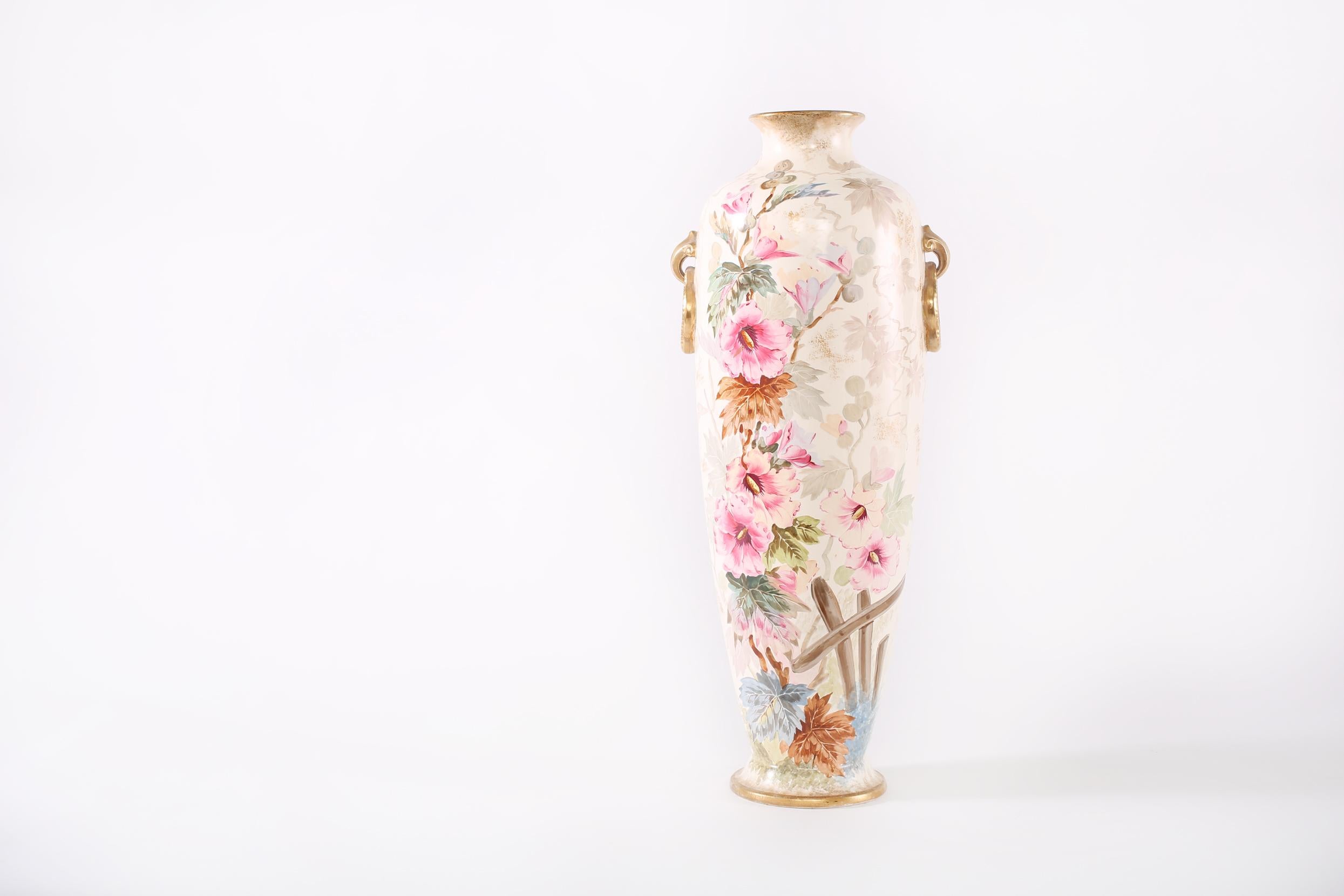 19th century very tall gilt porcelain decorative vase / piece with exterior floral design details . The vase / piece is in good condition . Minor wear appropriate with age / use . Numbered and marker's mark undersigned . The vase stand about 23.5