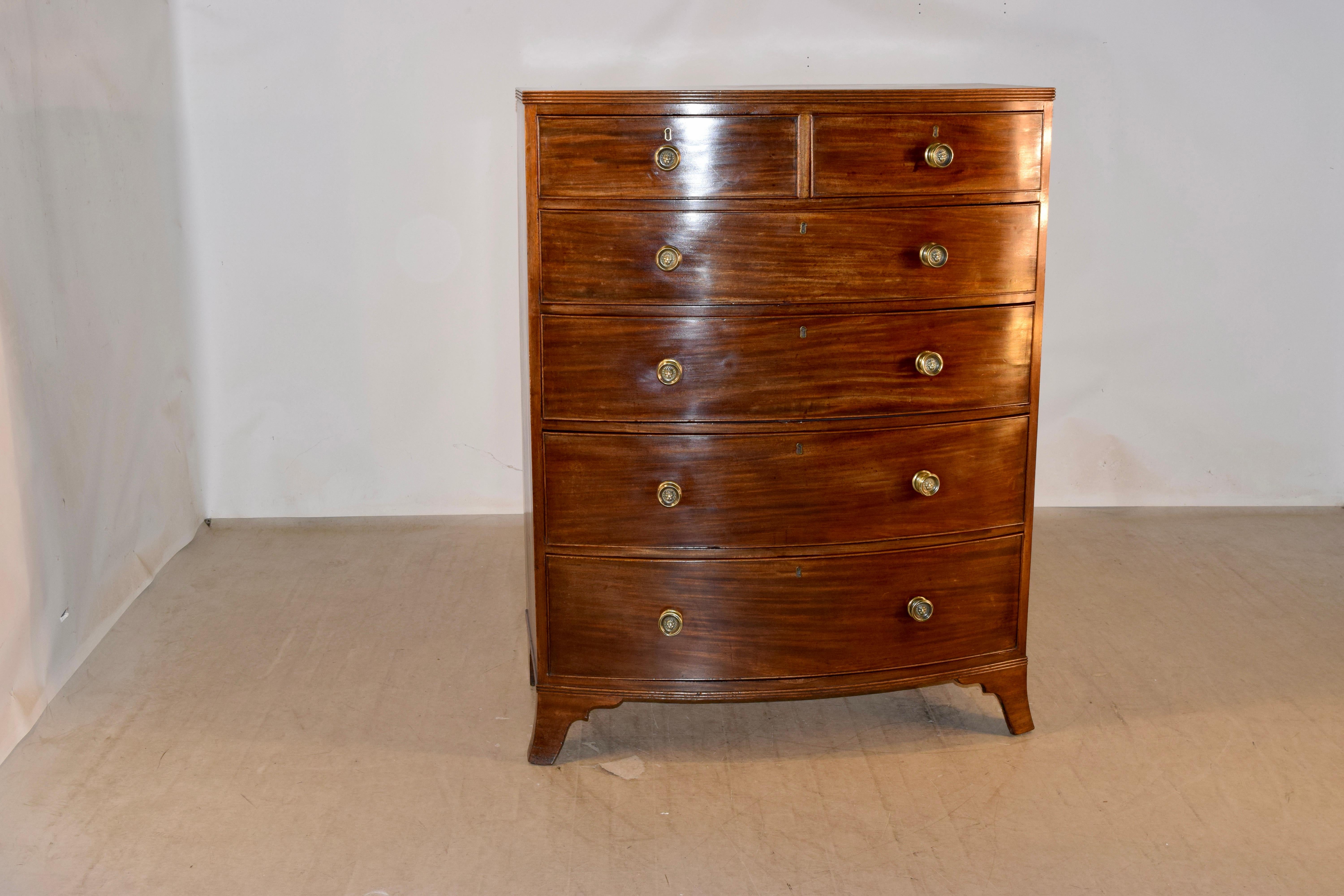 19th century tall mahogany chest of drawers from England with wonderful graining and a molded edge around the top, following down to two drawers over four drawers, all with beaded edges. The sides are simple and the case is supported on bracket feet.