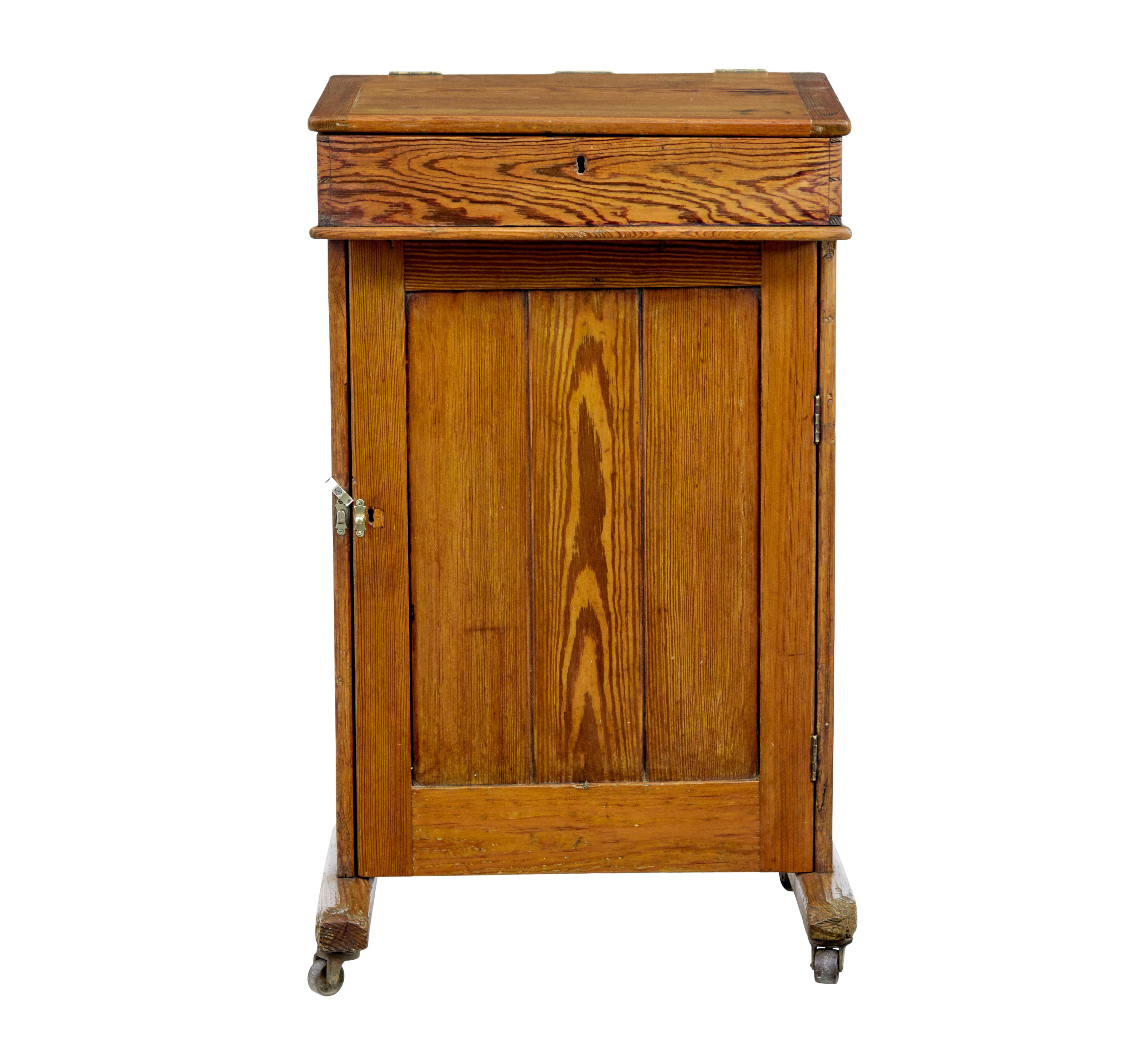 19th century tall pine lecture writing desk circa 1870.

Unusual standing desk which would have possibly been used for giving lectures or for concierge administration.

Made from pine, with a school writing slope flip lid, with a well underneath for