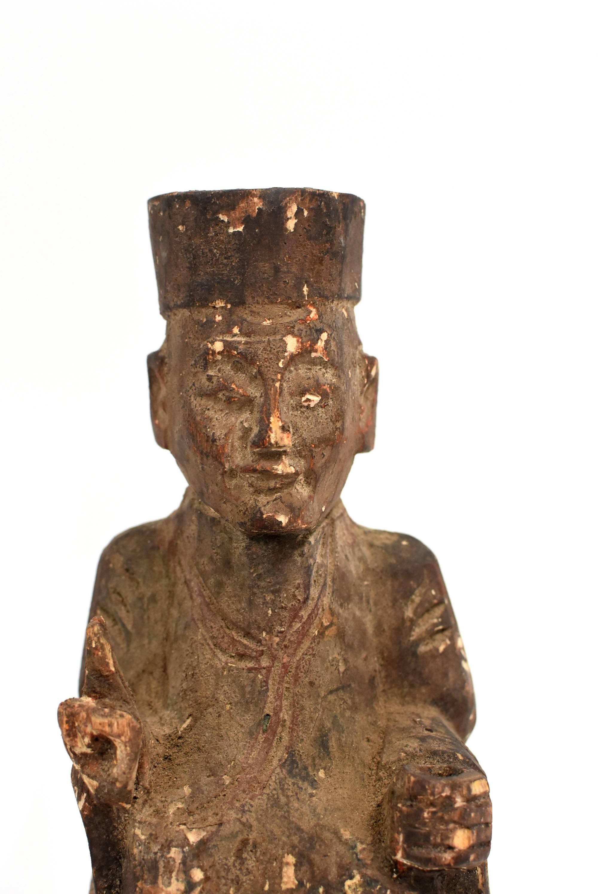 Very old solid wood statue depicts the Taoist Zen Master. He wears typical Tao robe and hat, with two fingers pointing up, and the left hand on his knee. Such a mudra symbolizes the connection of heaven and earth which is consistent with the Taoist
