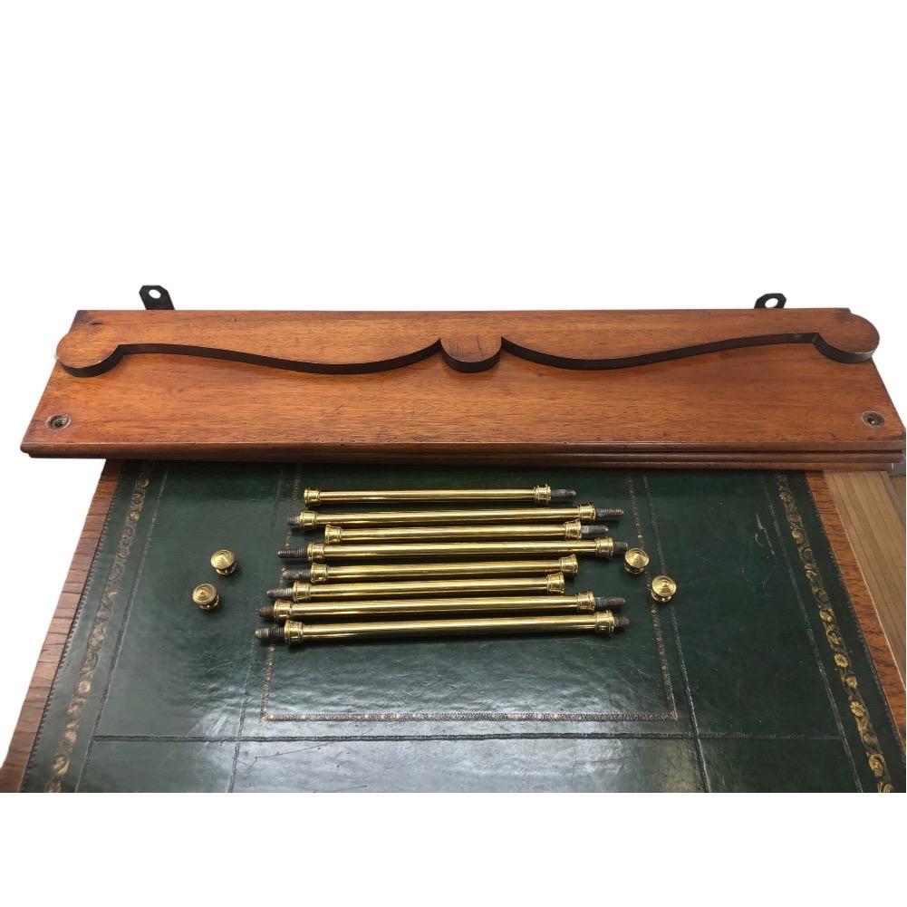 19th Century Teak and Brass Campaign Bookshelves. Campaign furniture was designed to be collapsable and portable for military and travel use. This example features a crested rail on the back of the bookshelves and is also removable. The shelves were