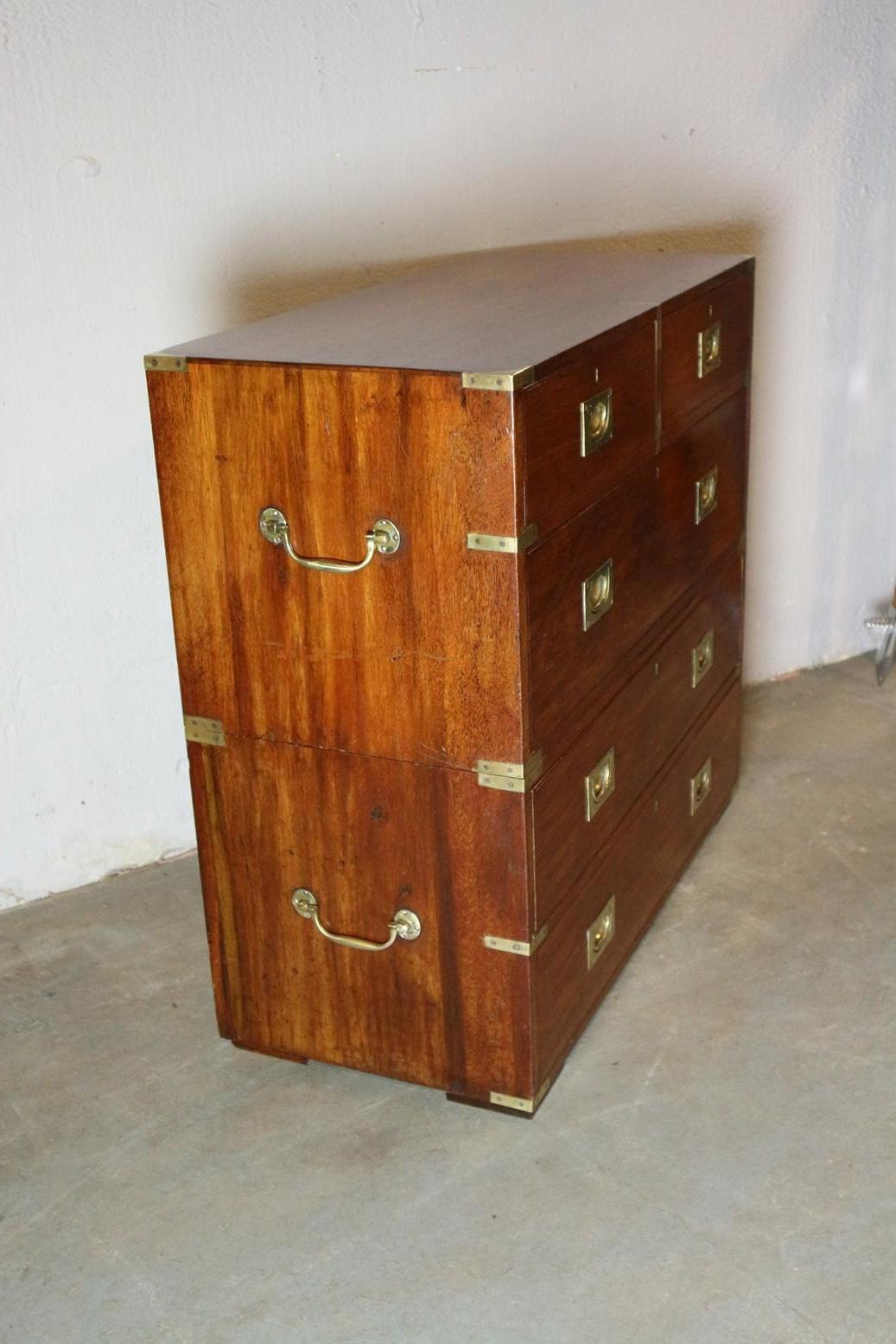 Antique teak Campaign chest of drawers in very good condition. In this cabinet, the brass corners and drawer pulls are polished to make it stand out. The cabinet consists of 2 parts as usual with Campaign drawer cabinets,

Origin: