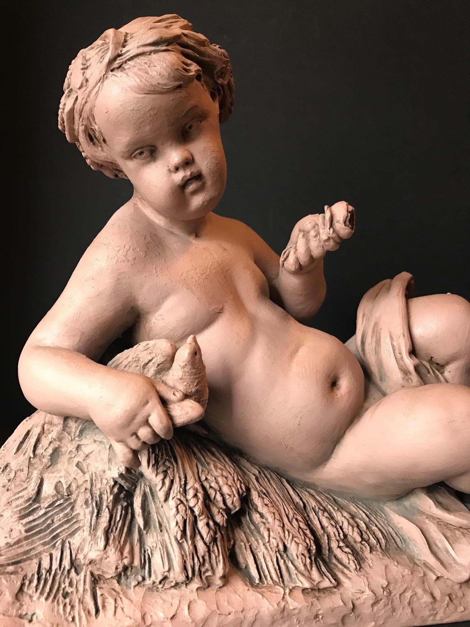 This 19th century terracotta sculpture of a putto feeding a bird is by Albert - Ernest Carrier - Belleuse (1824 - 1887). The terracotta is signed 
