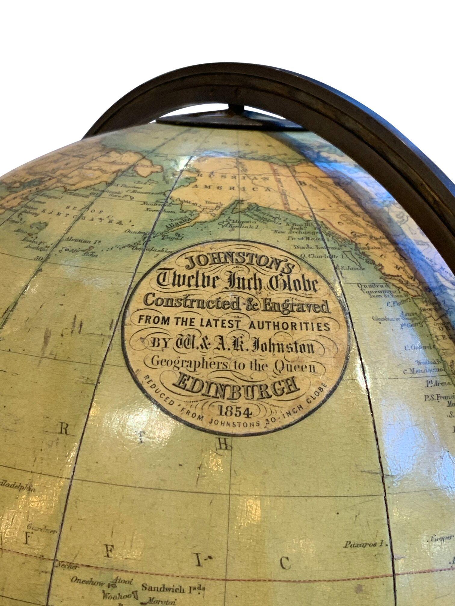 A 19th century terrestrial globe by W. & A.K. Johnson LTD. William Johnson (1802-1888) and Andrew Keith Johnson (1804-1871) founded and published globes in Edinburg, Scotland, since 1828. This is a very impressive 12th globe in excellent condition,