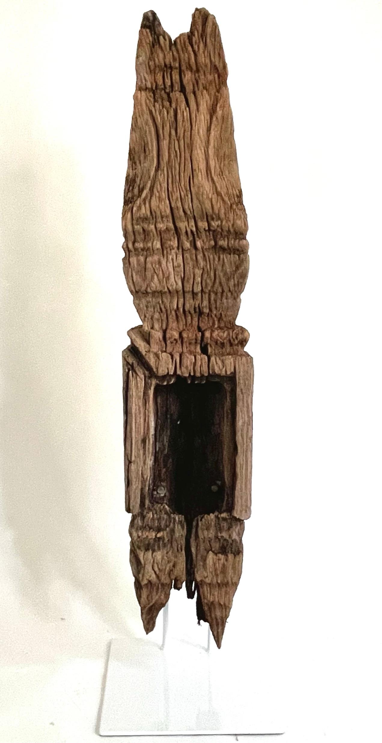 A rare 19th century Thai carved wood stupa made from the heart wood of the Teak tree. This stupa is from Isan region of the Thailand (northern Thailand, western Loas). This finely hand crafted Stupa (a small model of a Buddhist temple) was once used
